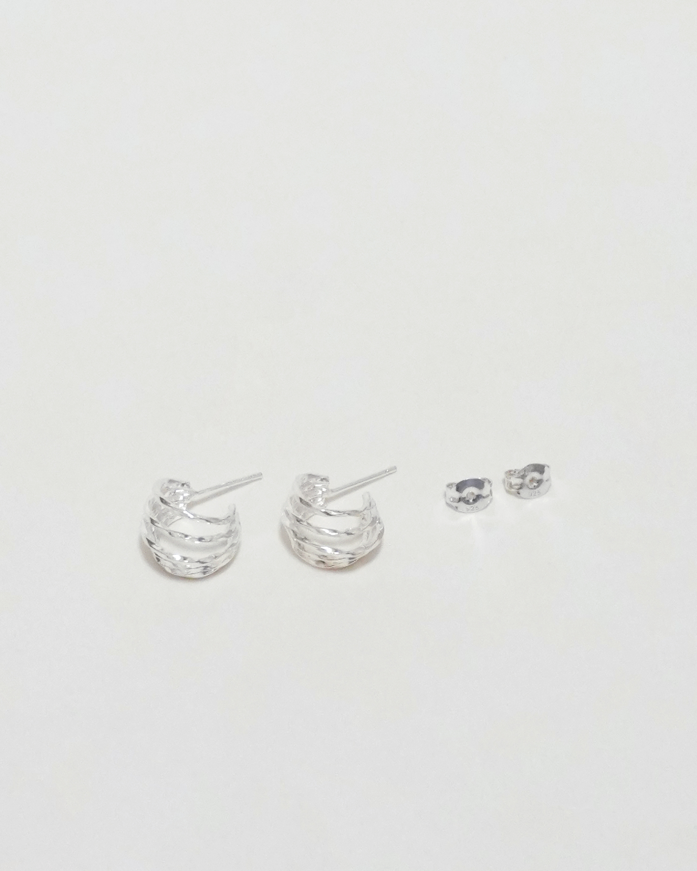 Rhythmic Lunar Twist Hoops