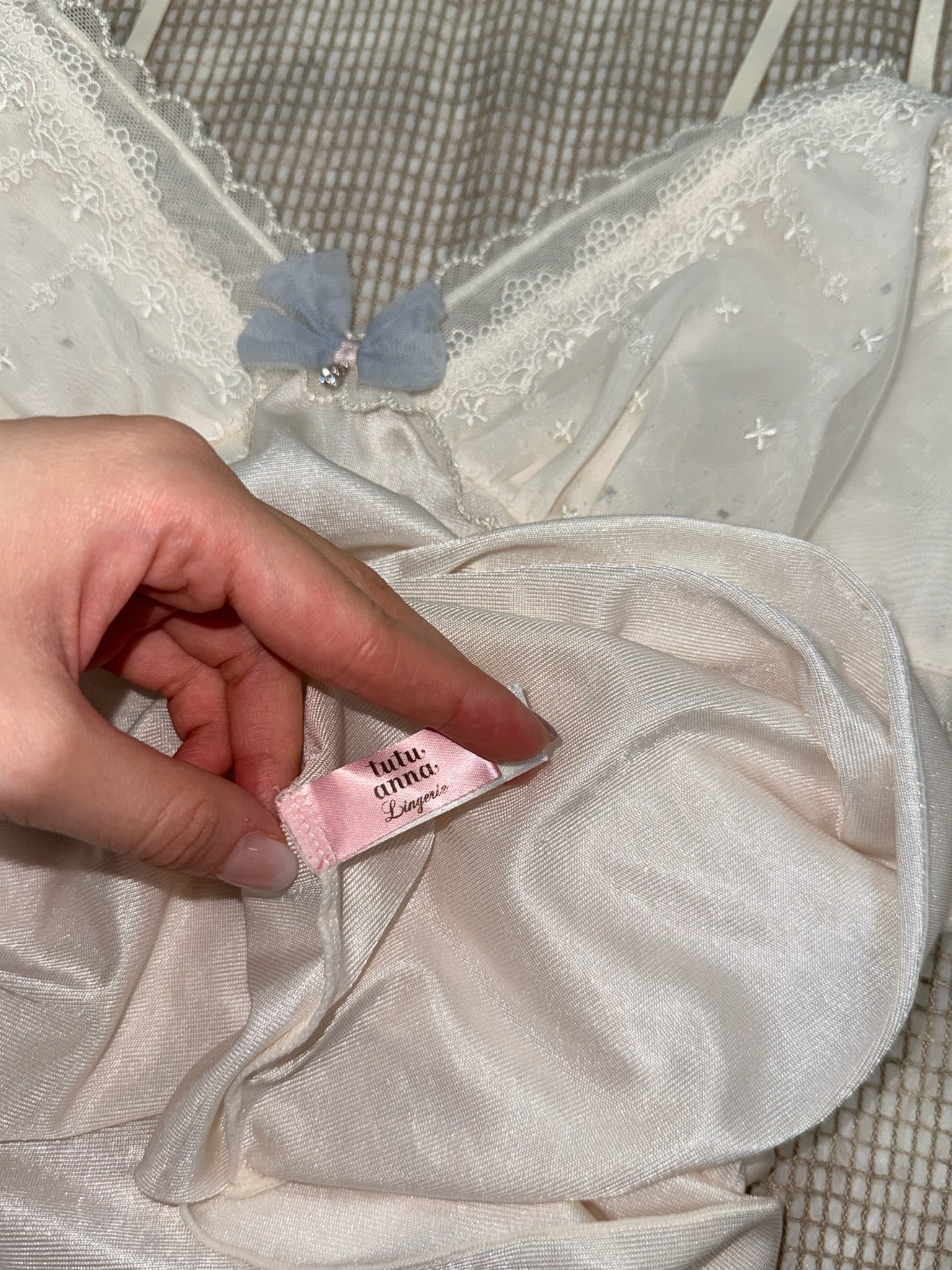 White Satin Camisole Top with Lace Embroidery and Blue Bow Detail