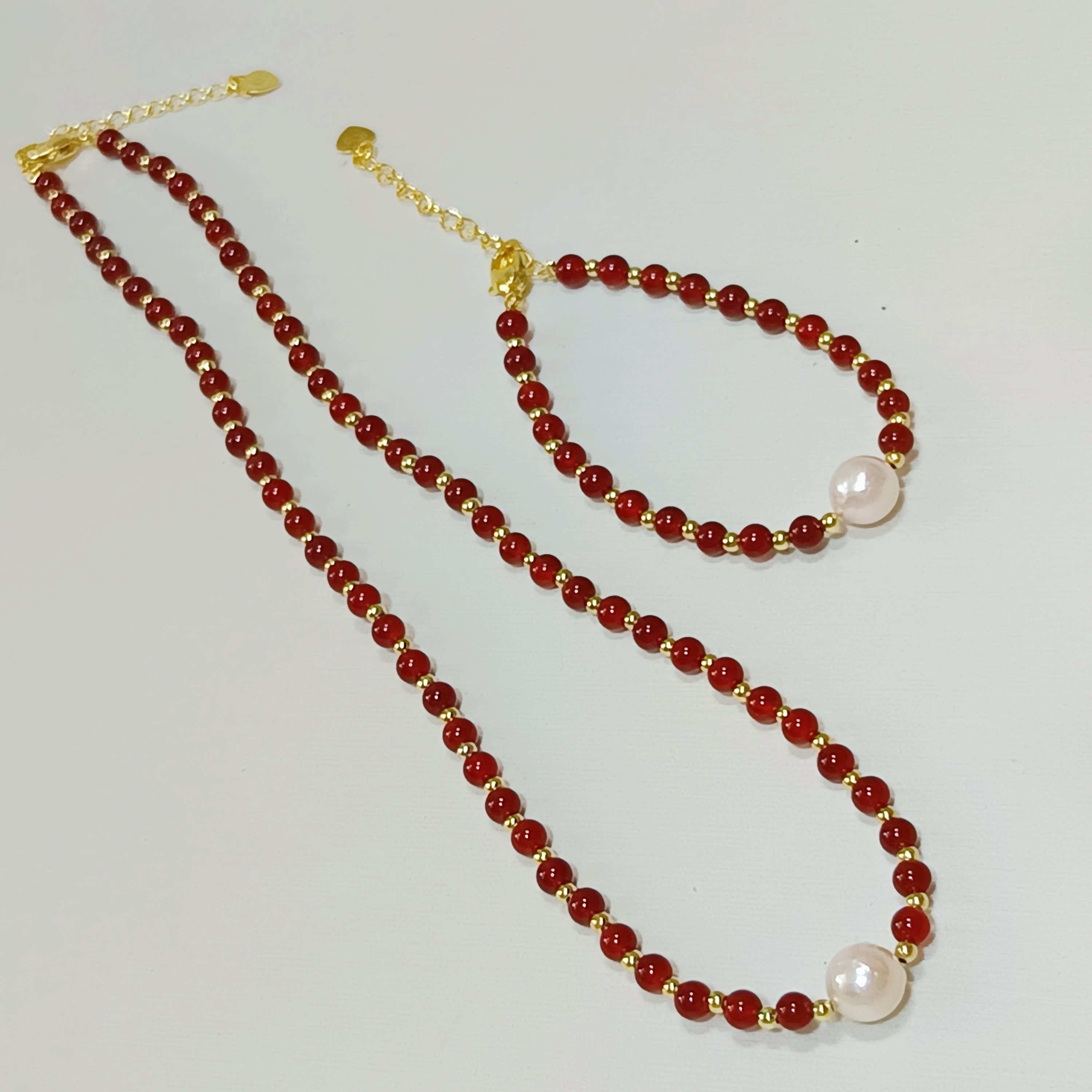 正圓極強光日本akoya櫻花粉海水珍珠+紅瑪瑙注金尾鍊扣項鍊手鍊套裝