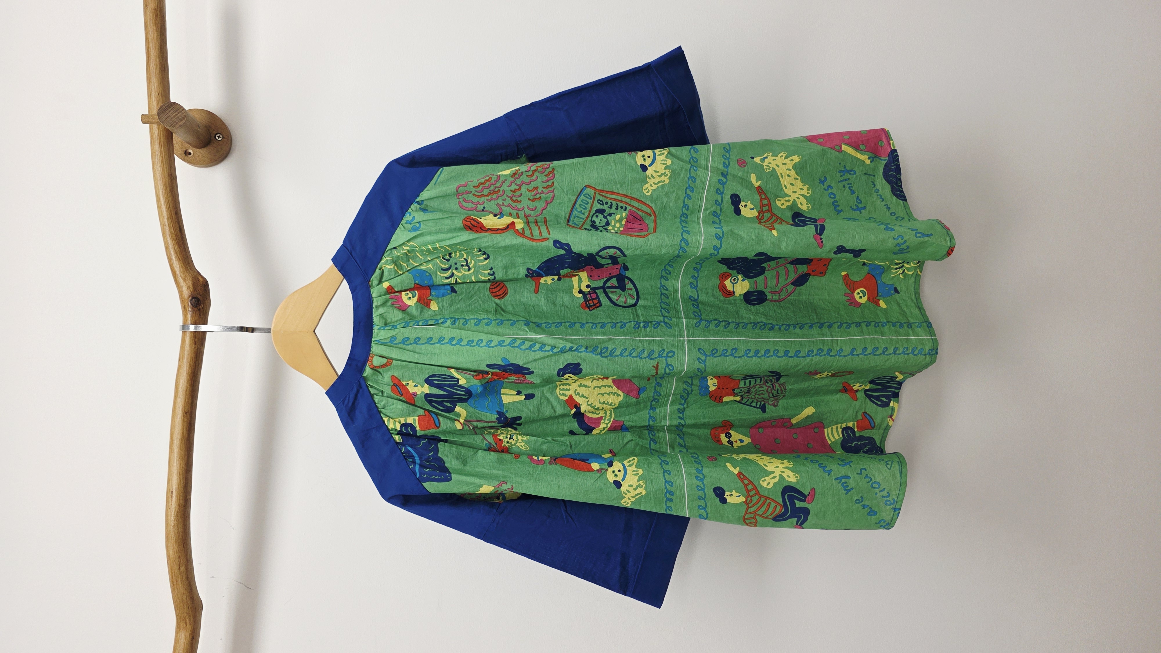 日牌藍拼背公仔圖案開胸裇