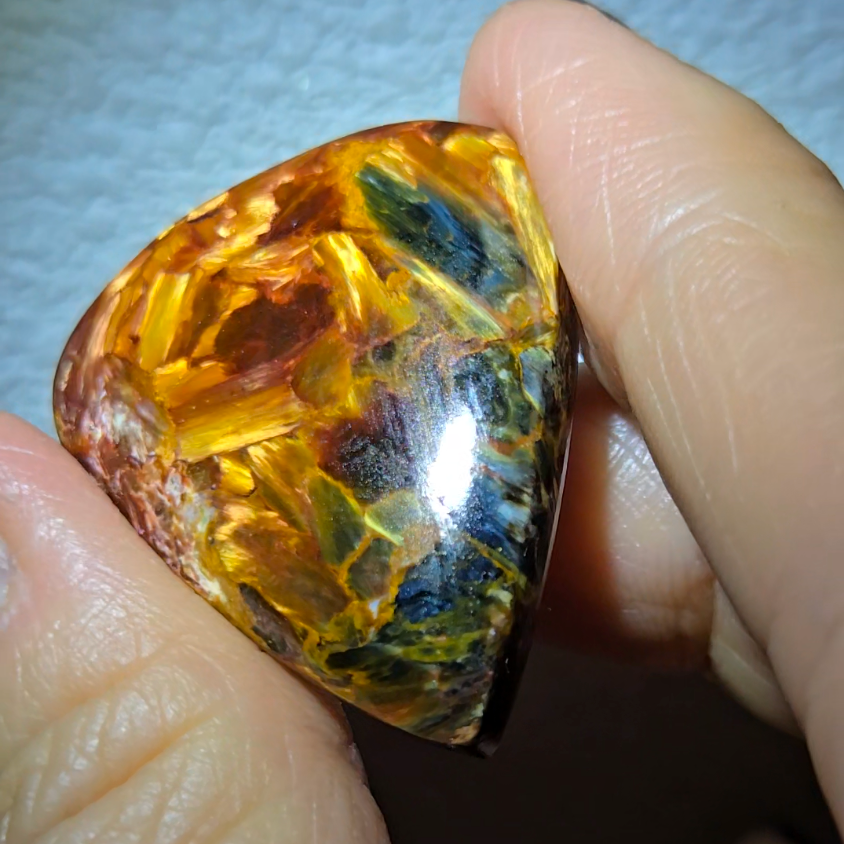 Red, gold, and blue pietersite cabochon - PT10