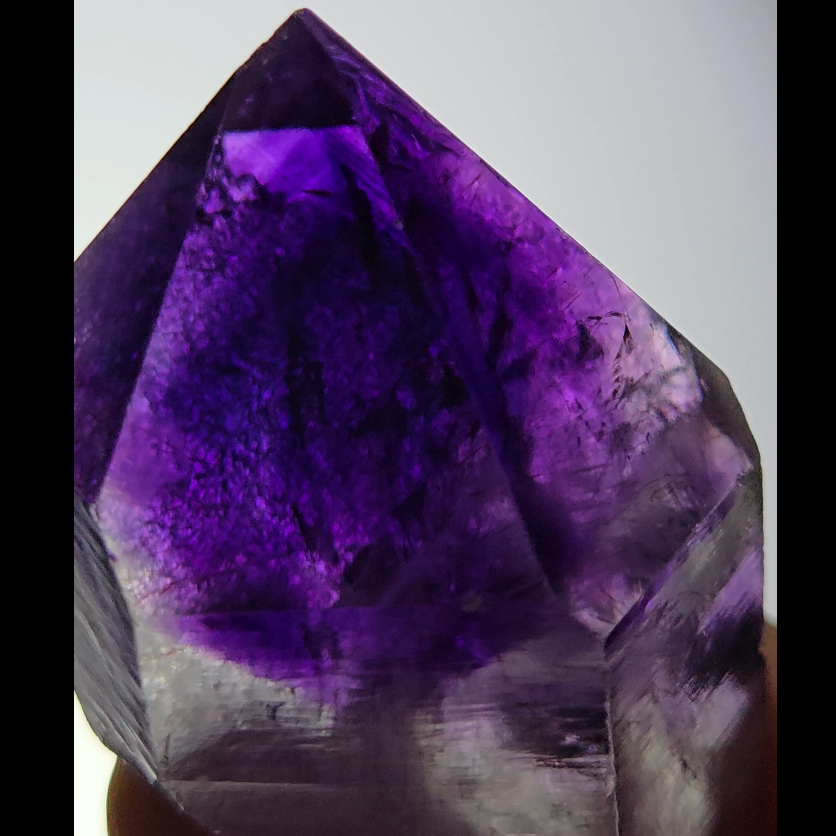 Blue amethyst point with phantom pyramid inclusions - AM143