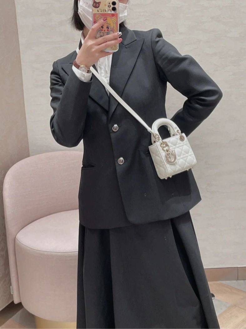 Elegant Women's Black Suit with White Mini Handbag