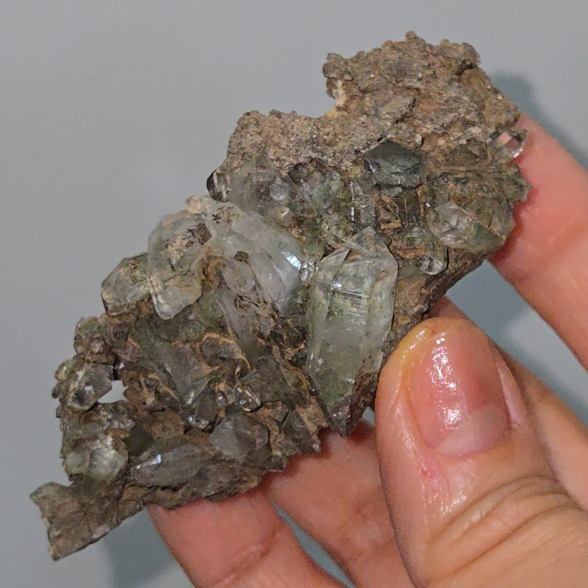 Epidote inclusion quartz cluster - CQ505