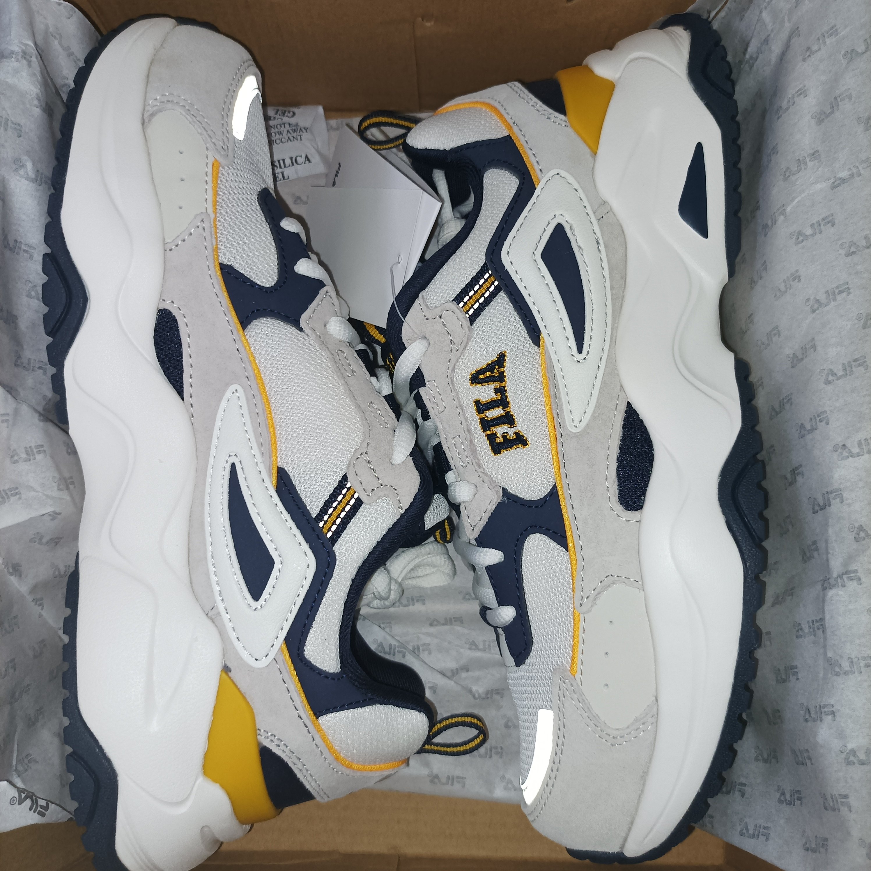 Fila white hot sale yellow blue