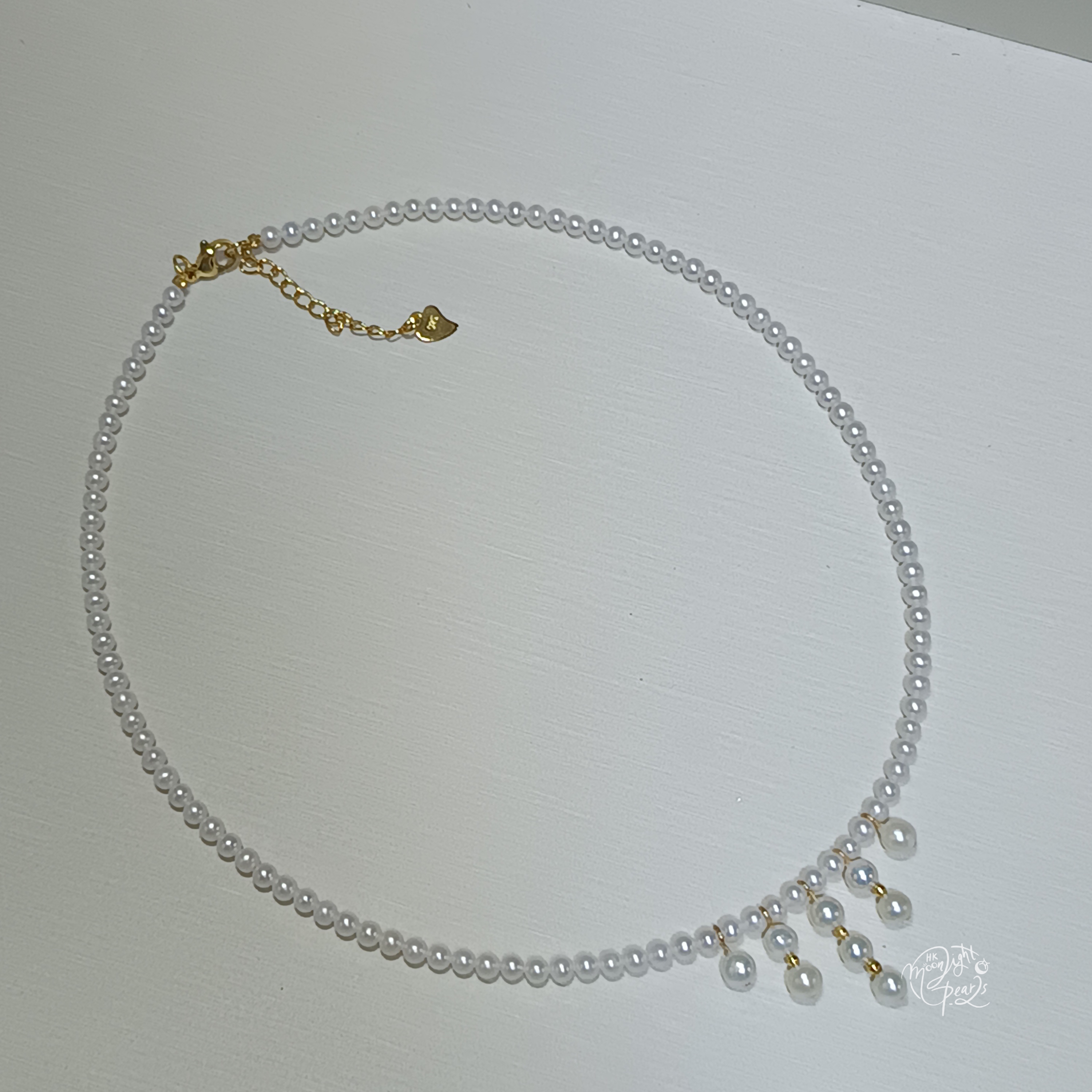 近正圓極強光淡水ak白細胞珍珠注金愛心尾鍊扣時尚流蘇項鍊