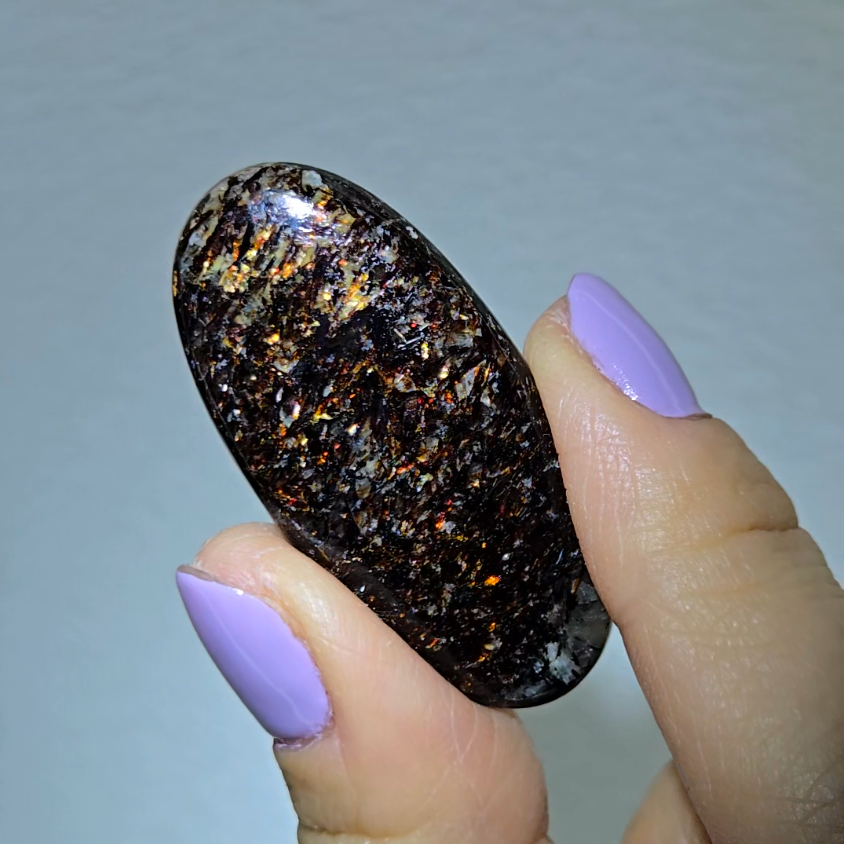 Astrophyllite cabochon with red, golden, bronze inclusions - AST25 