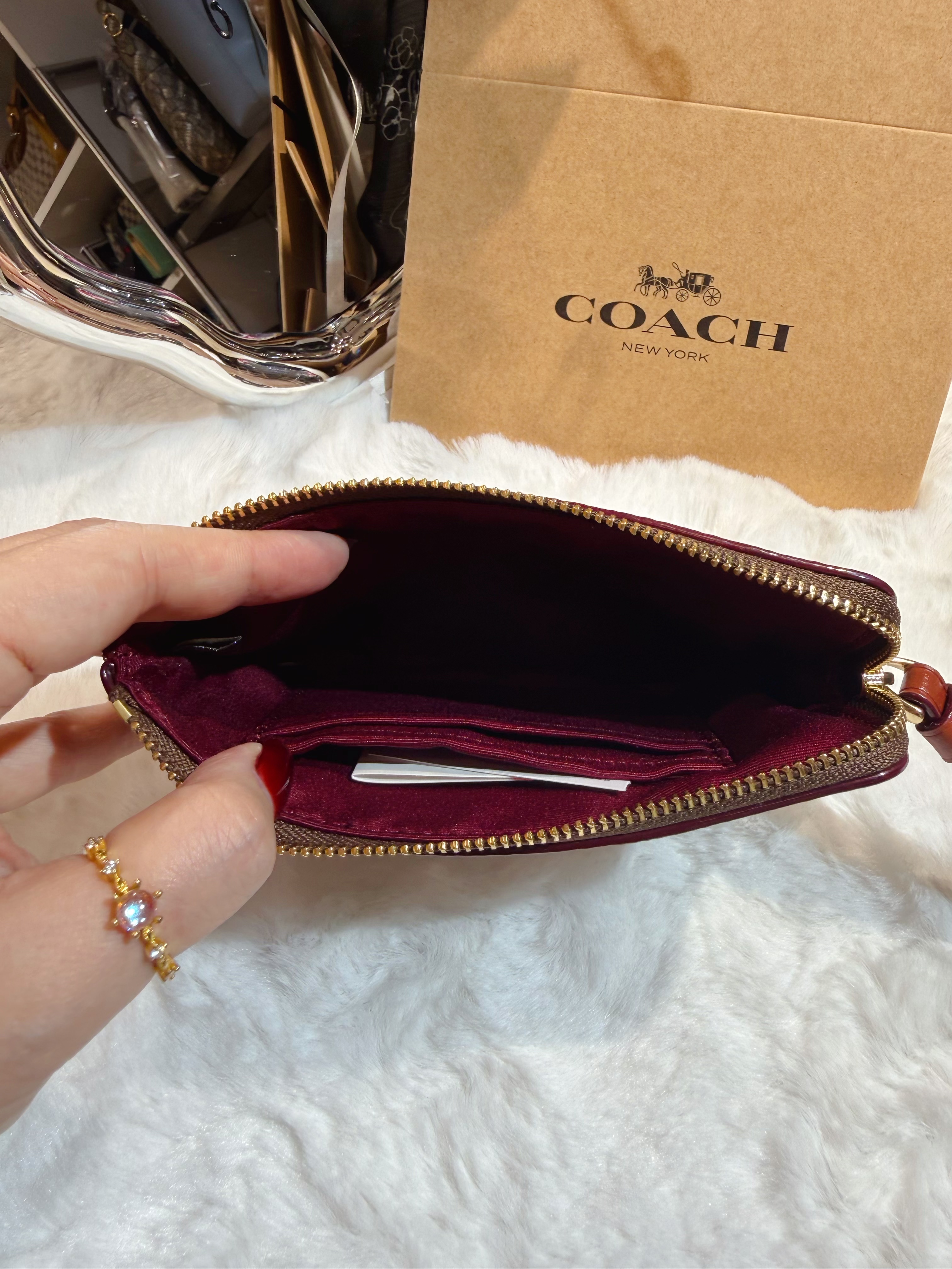 Coach wristlet logo/m/dinosaur
