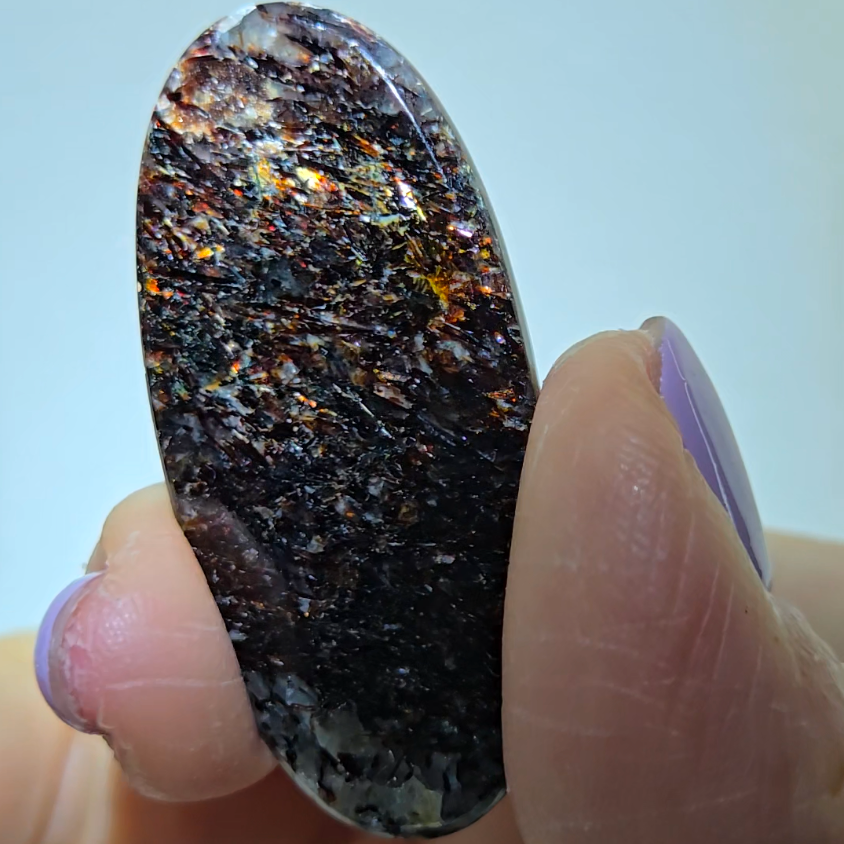 Astrophyllite cabochon with red, golden, bronze inclusions - AST25 