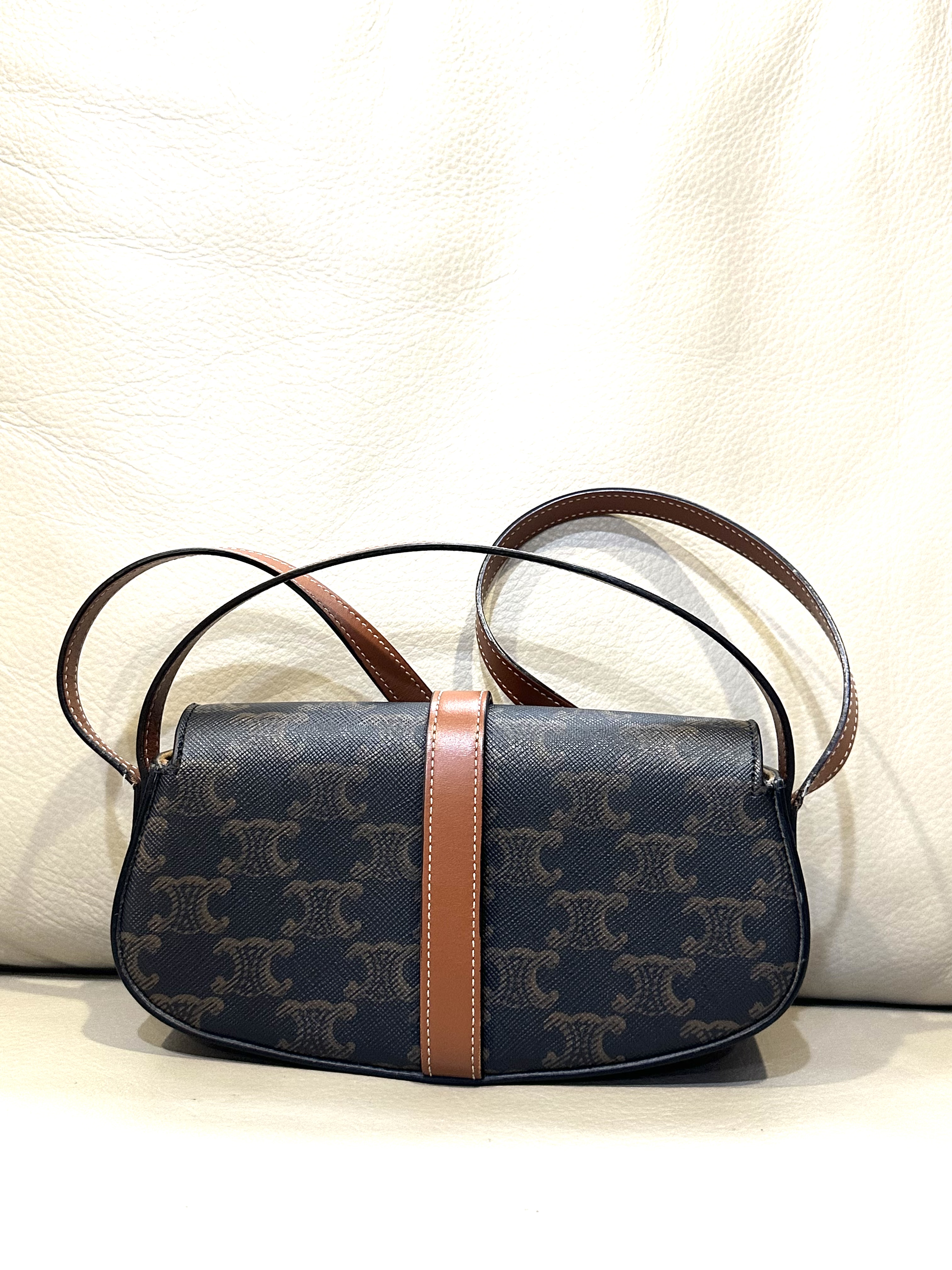 Pre-owned Celine Triomphe Canvas Clutch on Strap Tabou / Product Code: 26040503