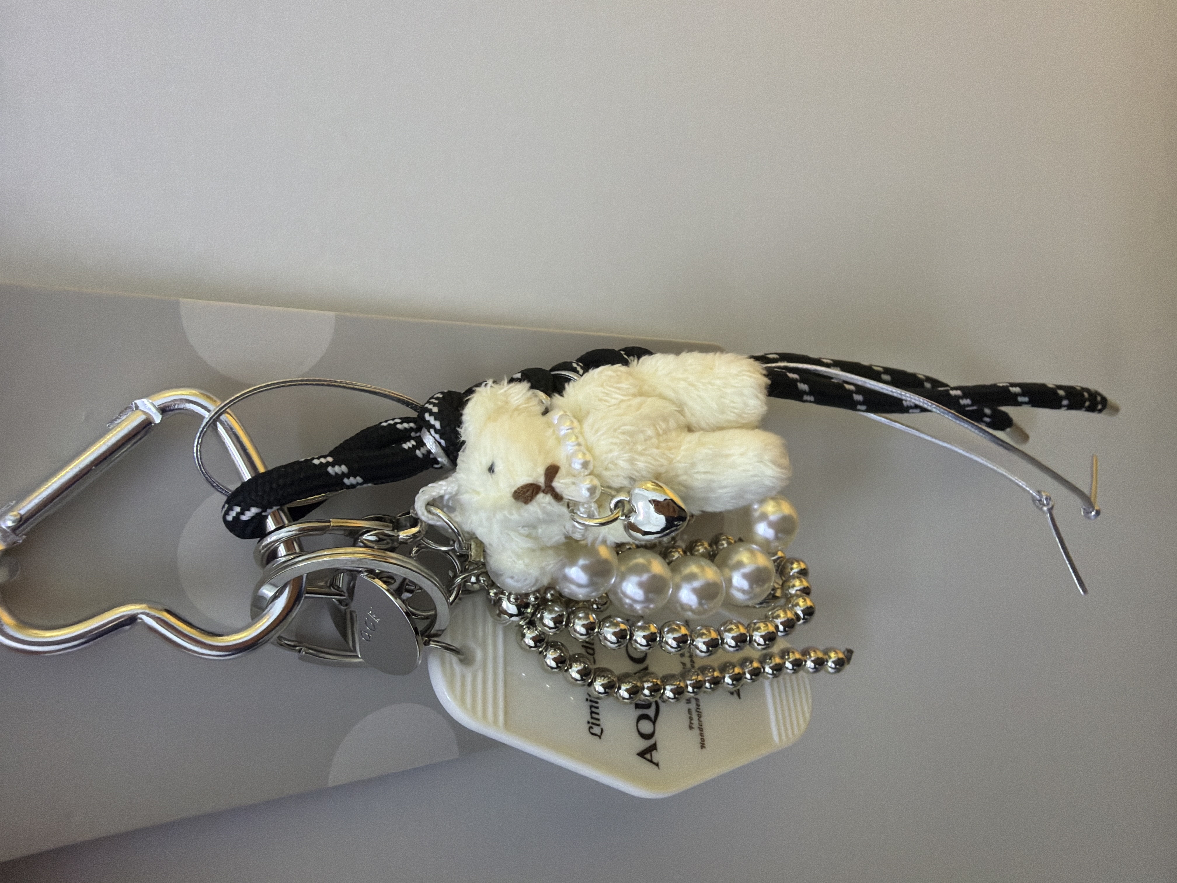 Multi-charm keychain with baseball, bat, star, whale tail, and numbered/lettered beads