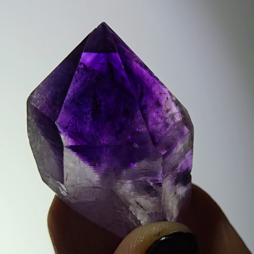 Blue amethyst point with phantom pyramid inclusions - AM143