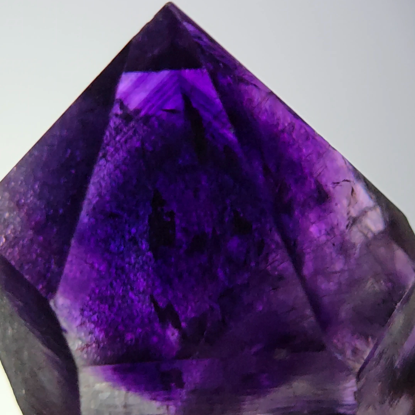 Blue amethyst point with phantom pyramid inclusions - AM143
