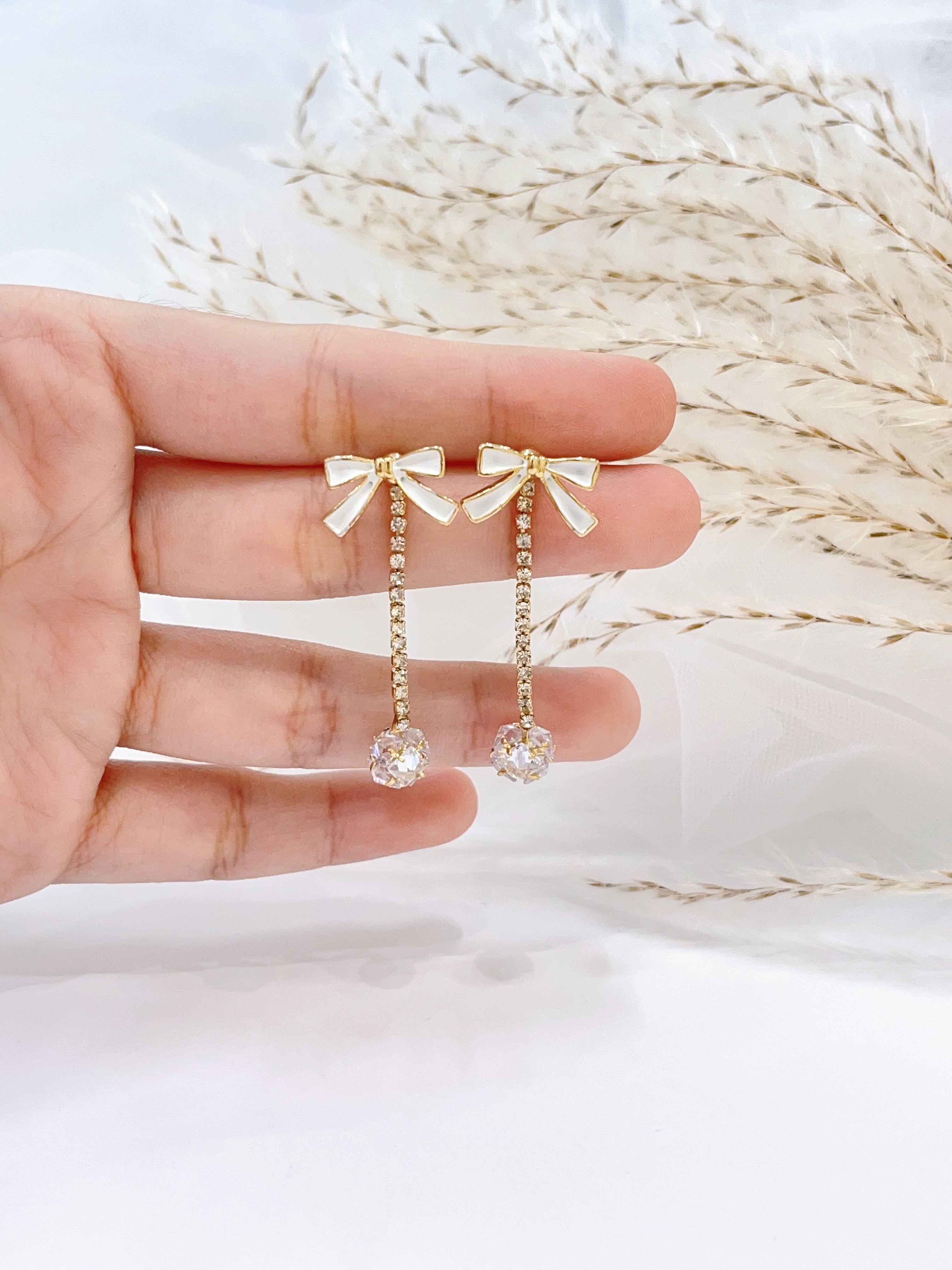 超闪钻球蝴蝶结长流苏耳环