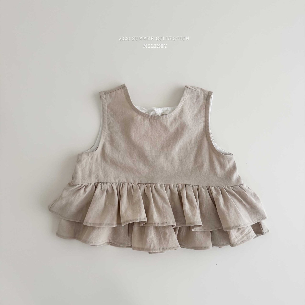 Ribbon Tiered Sleeveless Blouse