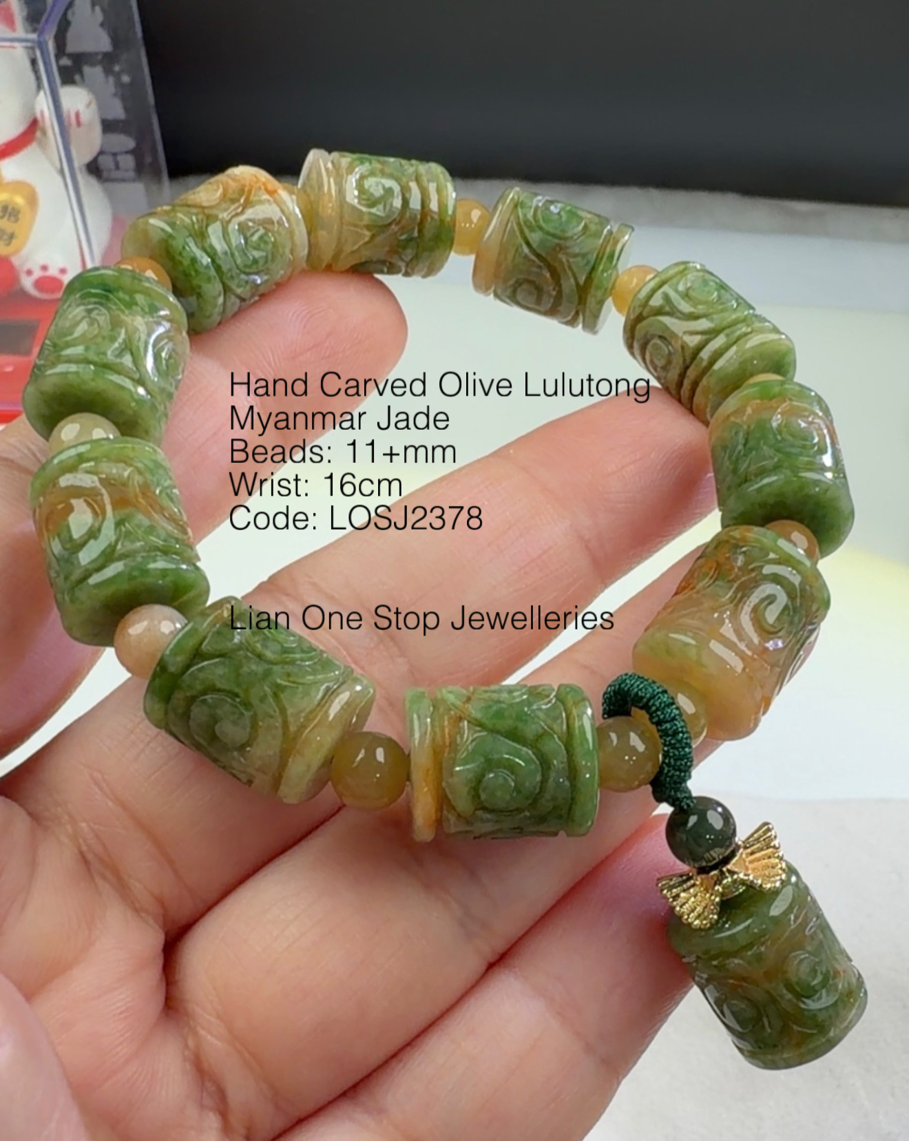 Code: LOSJ2378 Hand Carved Olive Lulutong Myanmar Jade 11+mm 