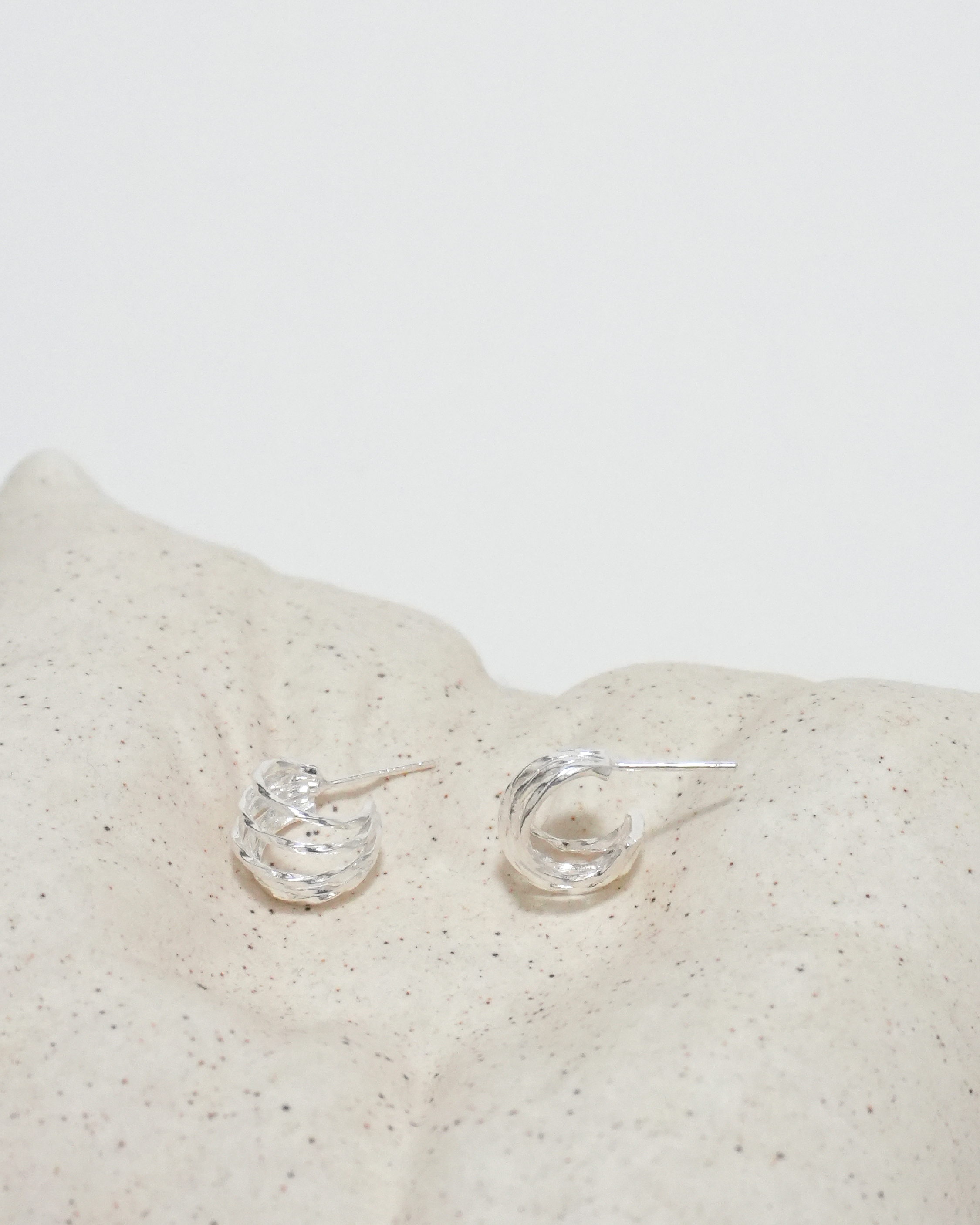Rhythmic Lunar Twist Hoops