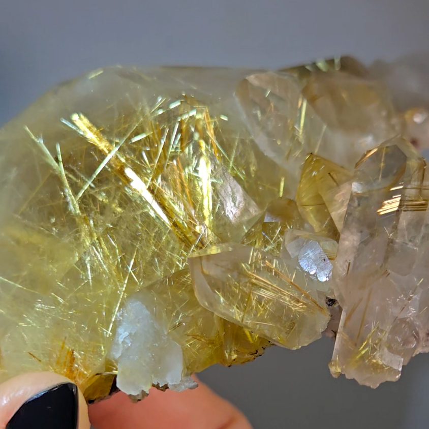 Golden titanium rutiles on black hematite in quartz cluster - RT1443