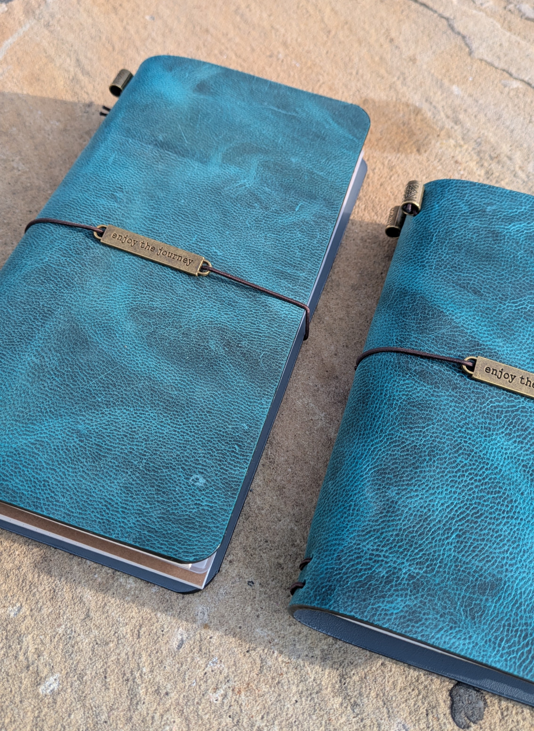 Hand-finished teal crazy horse leather, marked by natural pull-up lightening and organic marbling |