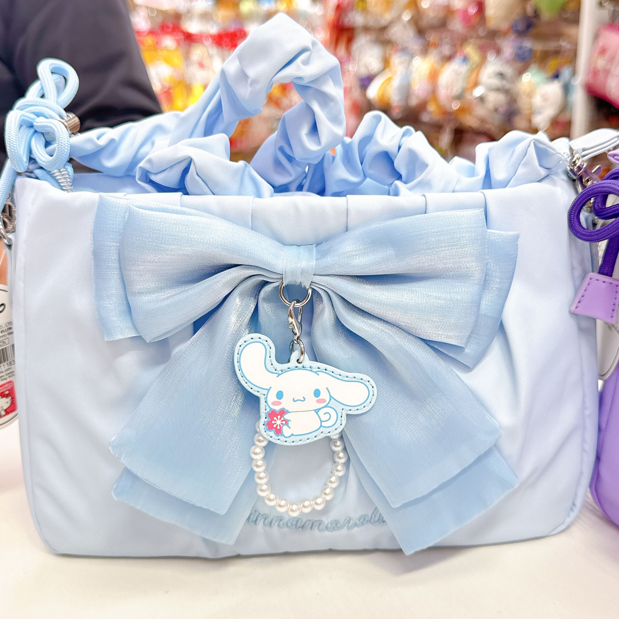 原裝行貨Sanrio Kuromi肉桂狗蝴蝶結斜孭袋 可以調校長做單肩包