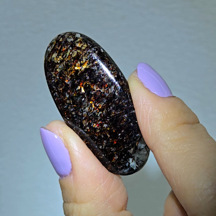 Astrophyllite cabochon with red, golden, bronze inclusions - AST25 