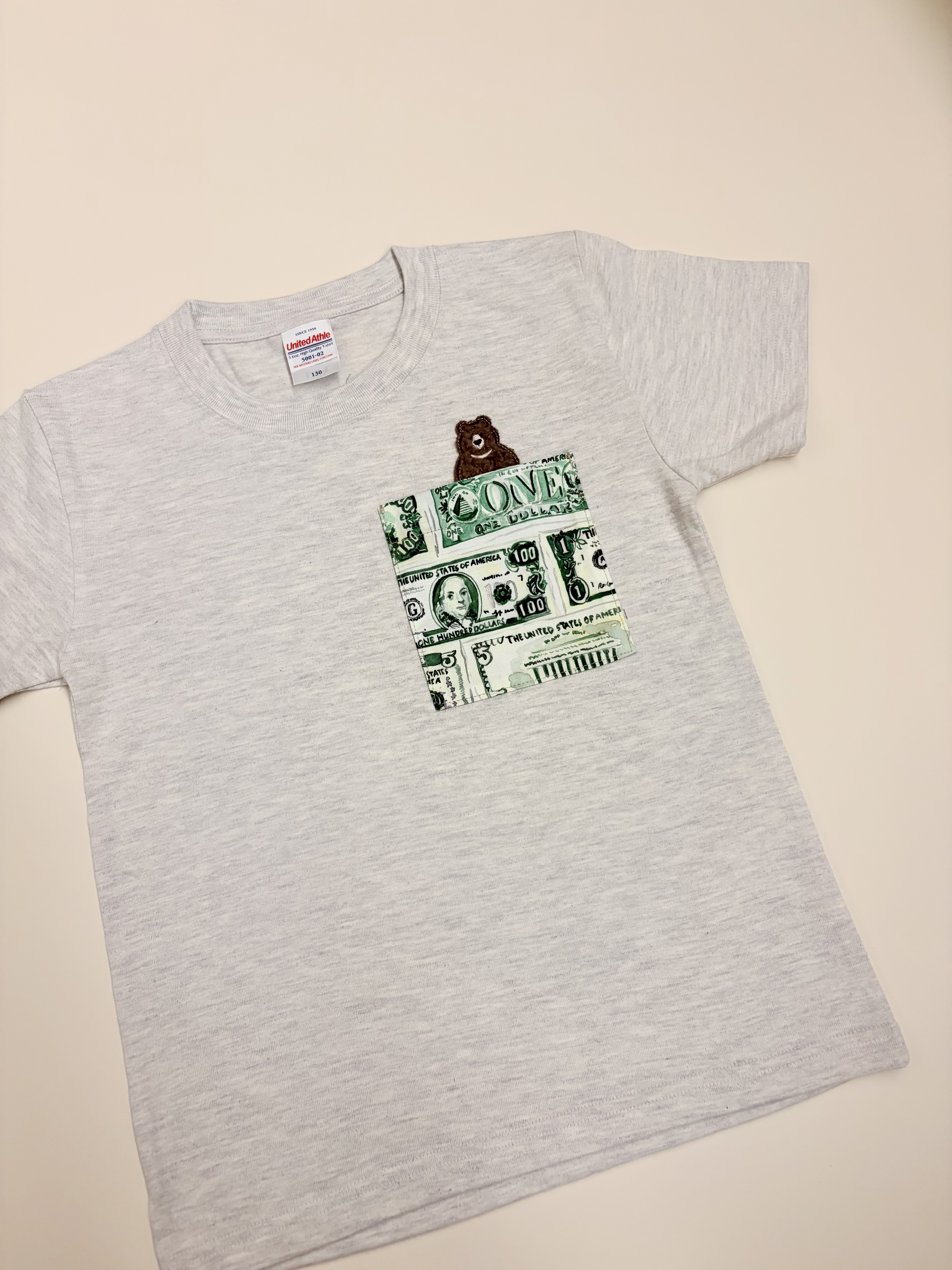 美元與小熊口袋T-Shirt（130碼）