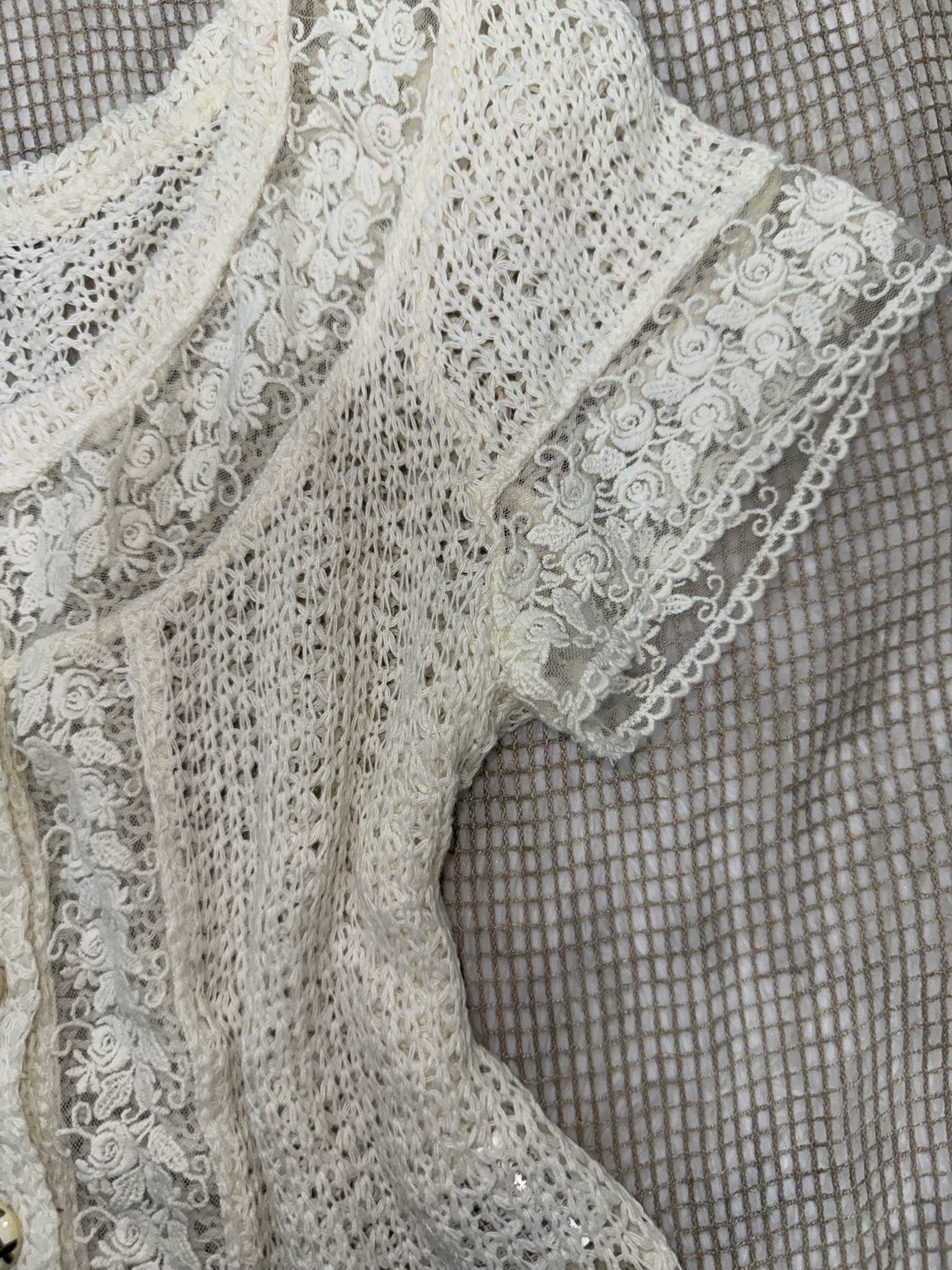 Cream Short-Sleeve Crochet Lace Blouse with Ornate Buttons and Floral Trim