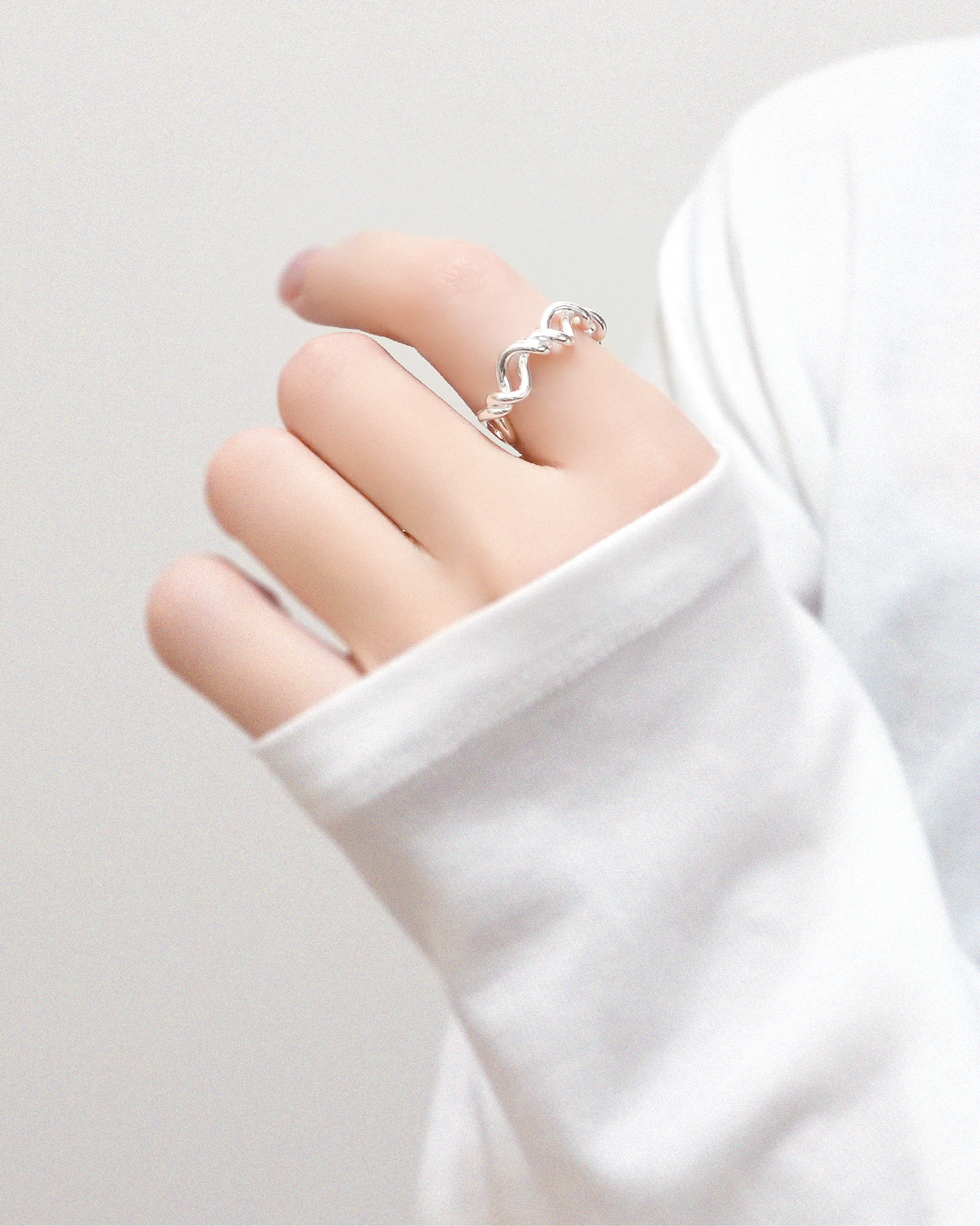 Fluid Margin Intertwined Ring