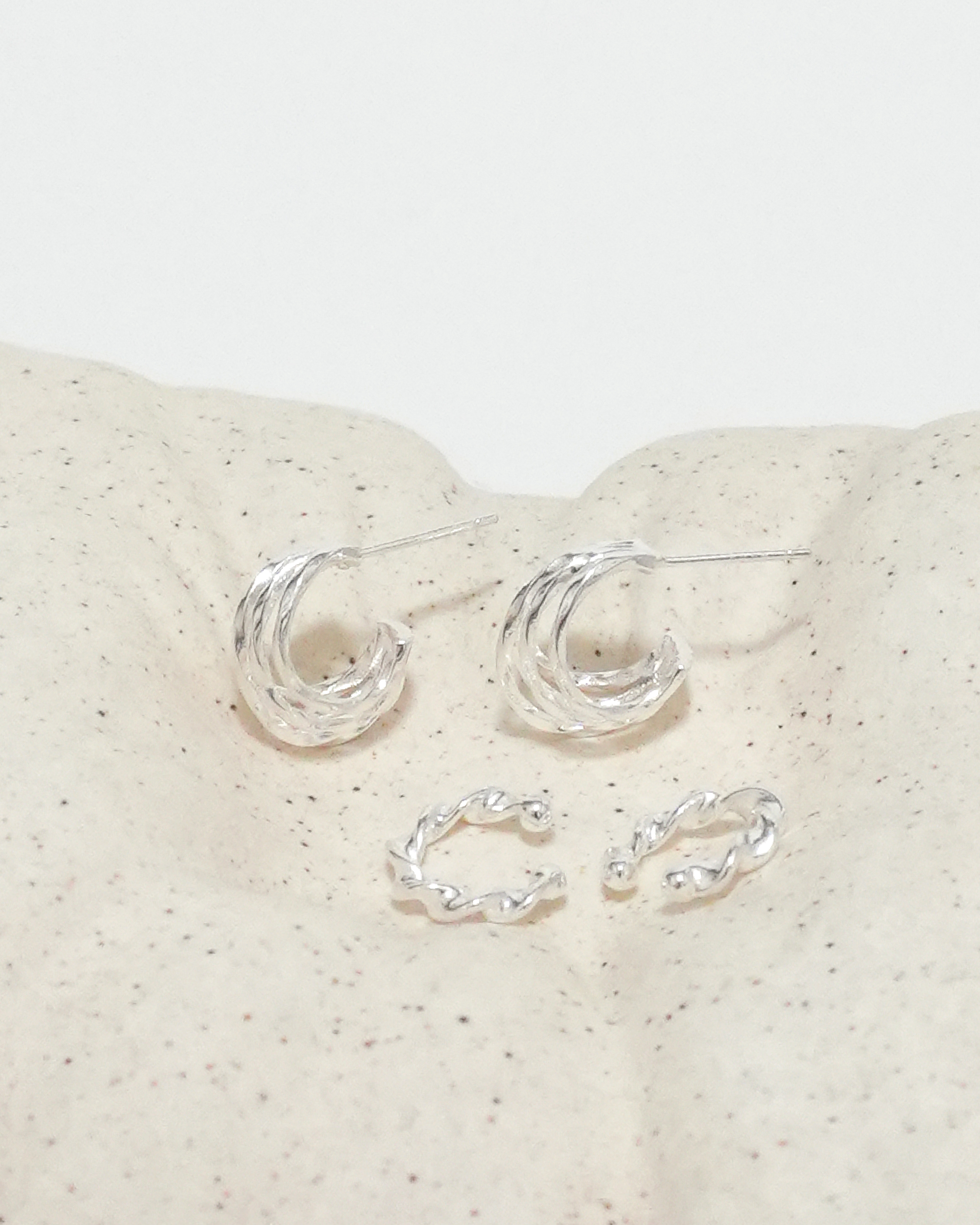 Rhythmic Lunar Twist Hoops