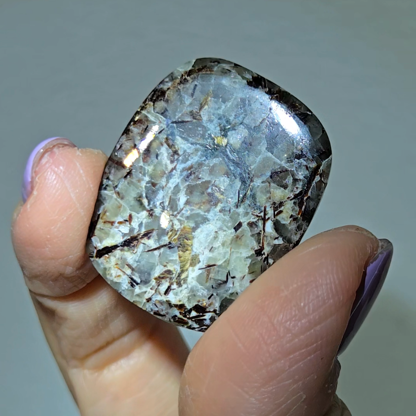 Astrophyllite cabochon with golden-bronze metallic inclusions - AST20