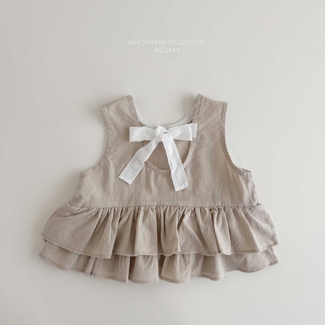 Ribbon Tiered Sleeveless Blouse