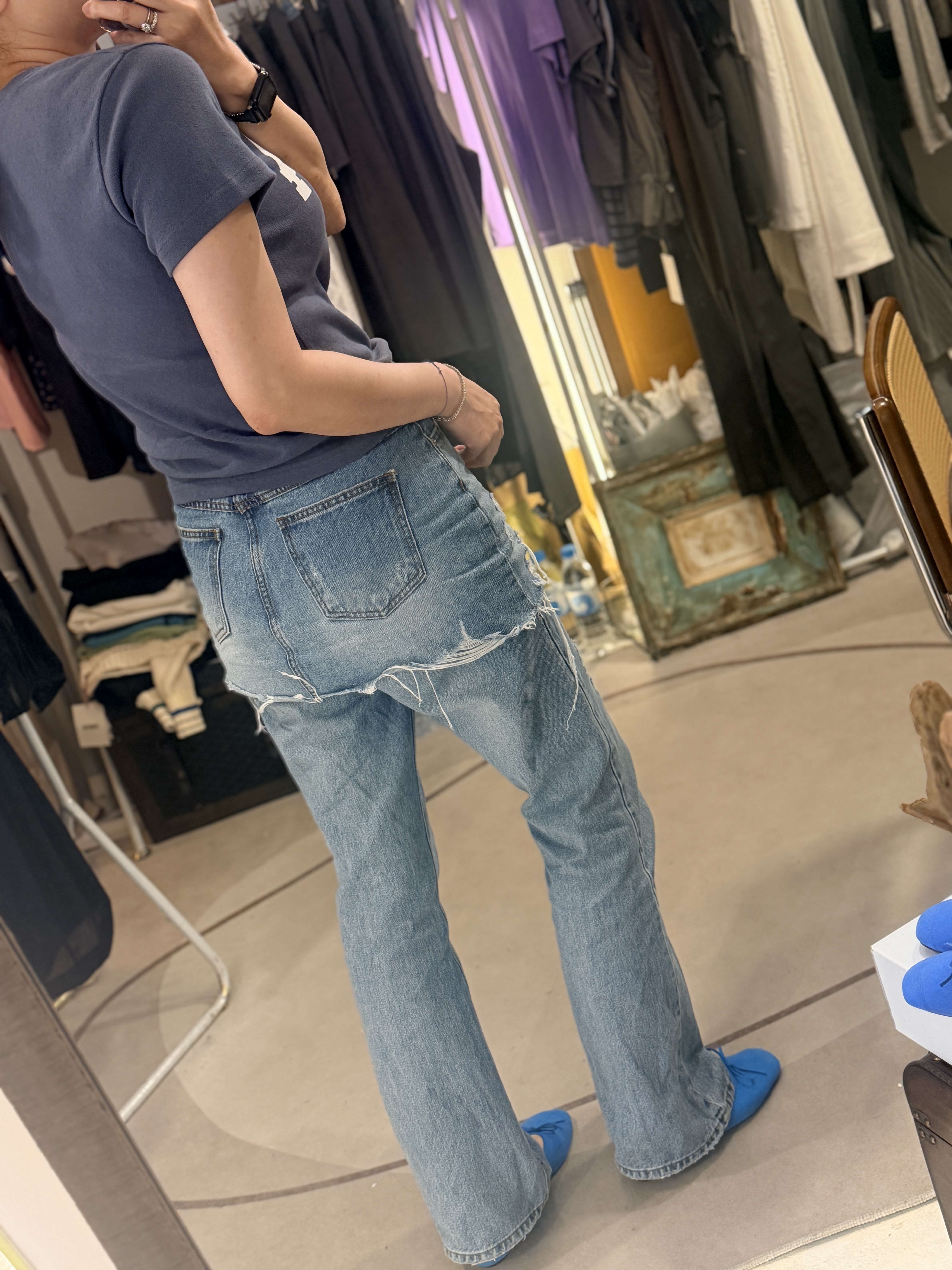 Denim skirt over jeans