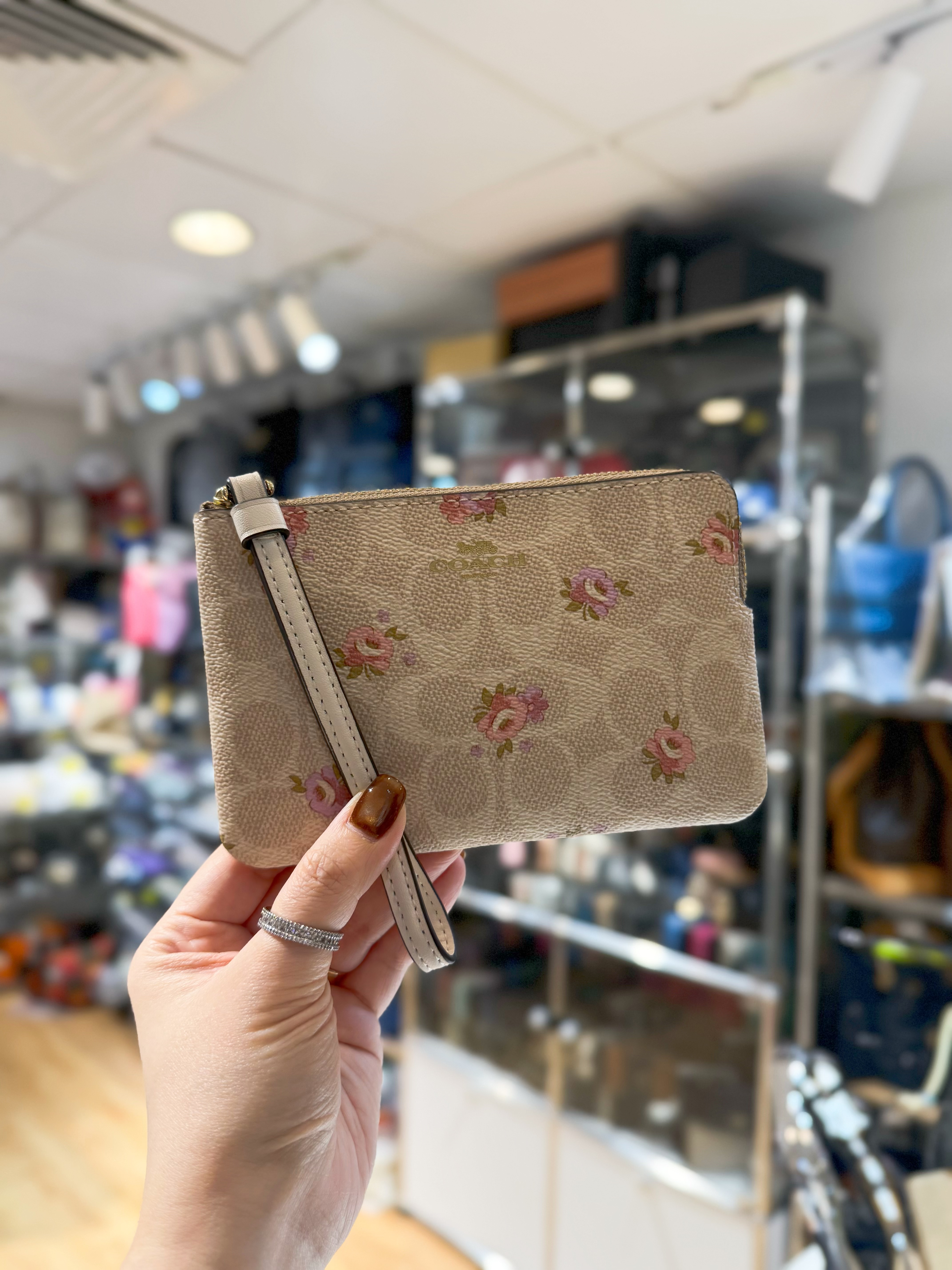 Coach wristlet white/m/floral