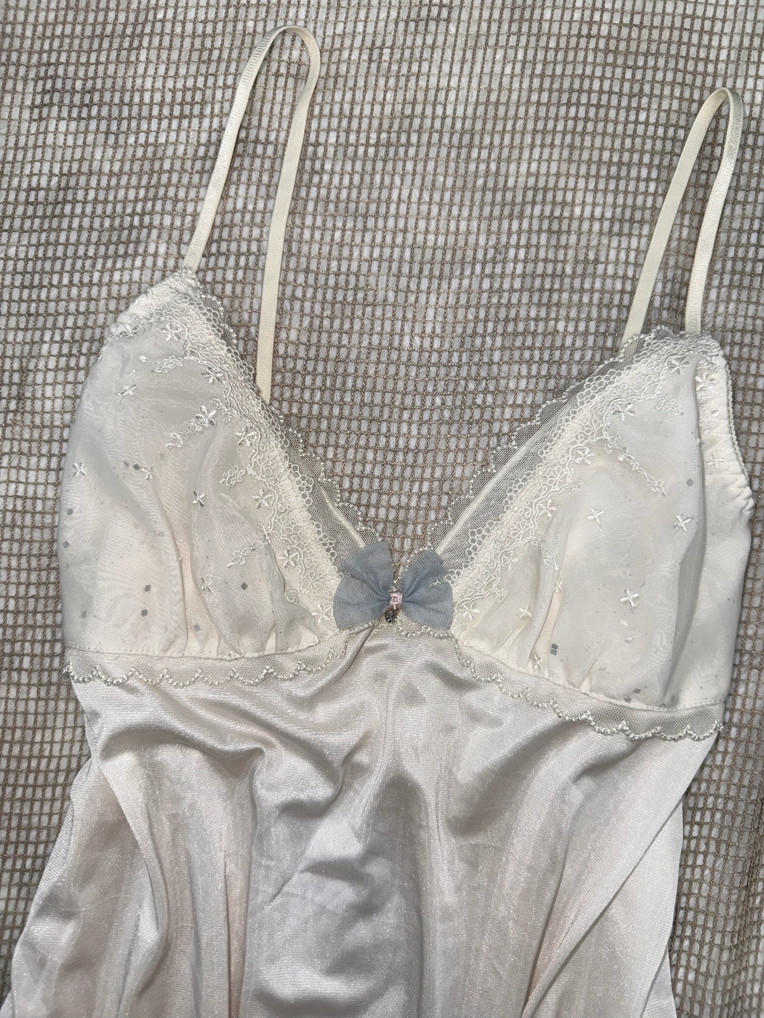 White Satin Camisole Top with Lace Embroidery and Blue Bow Detail