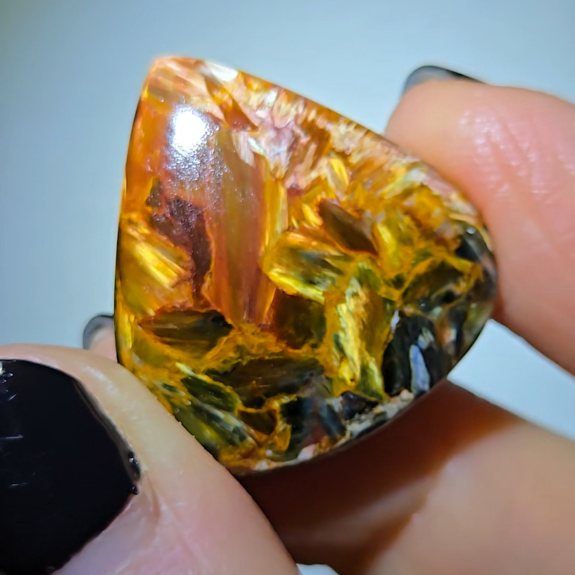 Red, gold, and blue pietersite cabochon from Namibia - PT7