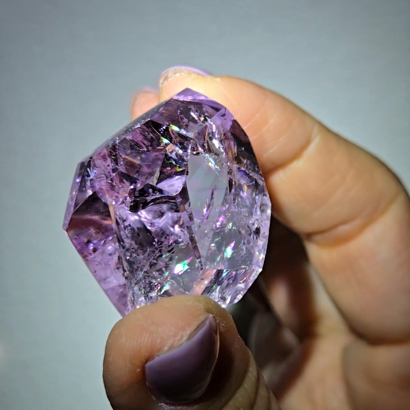 Amethyst pocket stone with rainbows and clarity - AM67