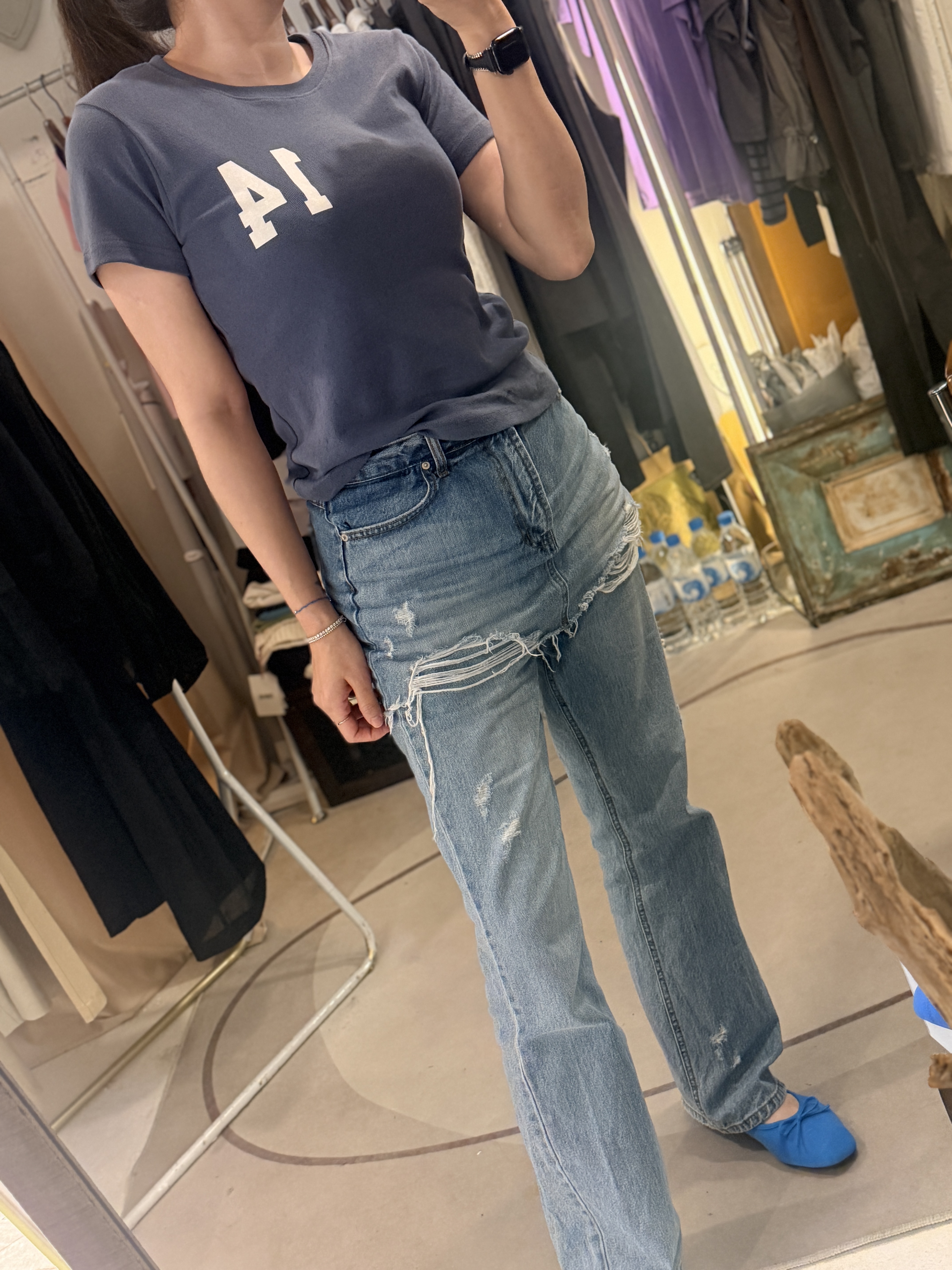 Denim skirt over jeans