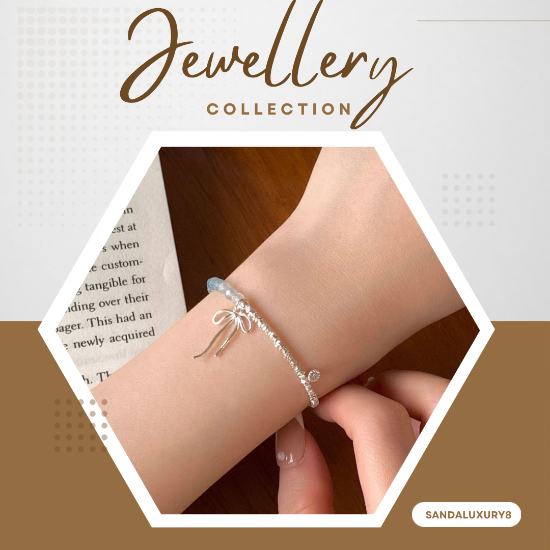 Silver Bracelet with Blue Beads and Bow Charm