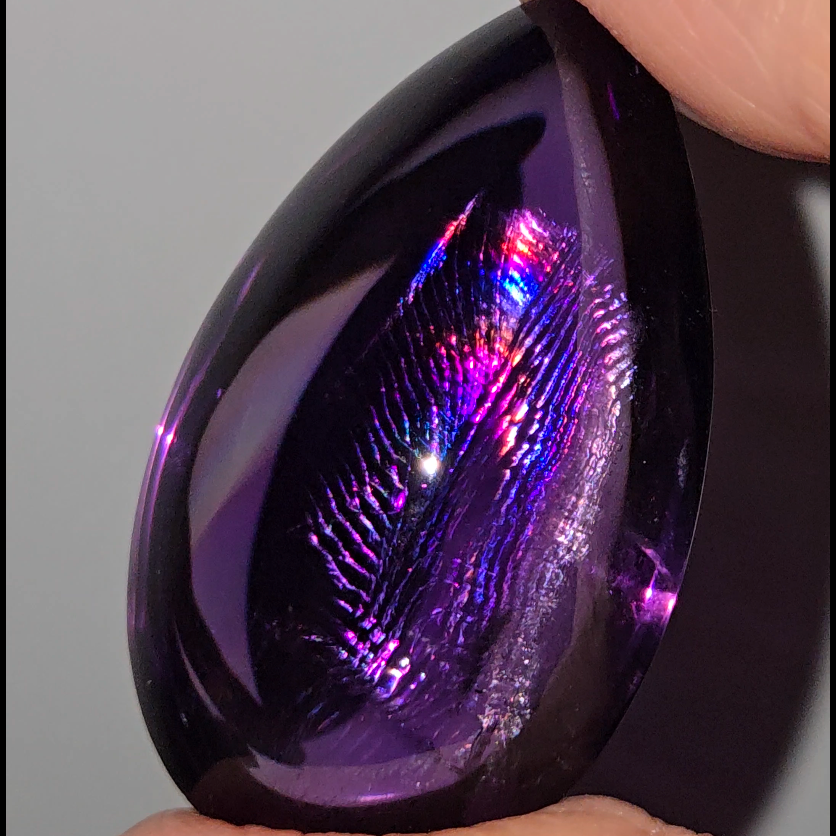 Amethyst cabochon with rainbows, fingerprint inclusions - A30