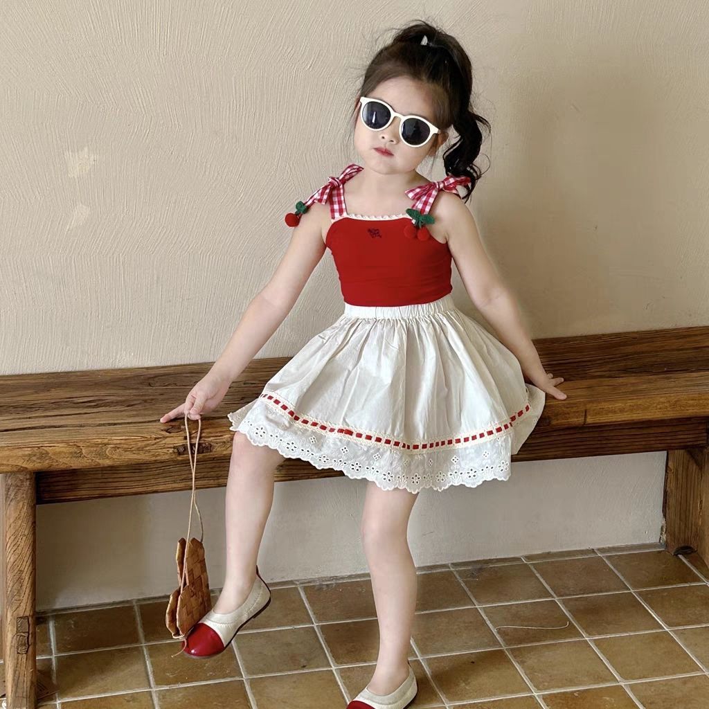 541744 | Girls' Adorable Red Top and White Skirt Set with Cherry Accents