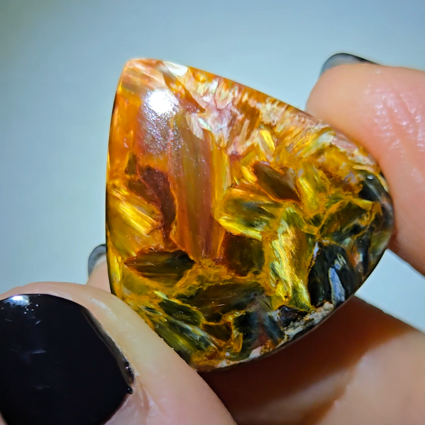 Red, gold, and blue pietersite cabochon from Namibia - PT7