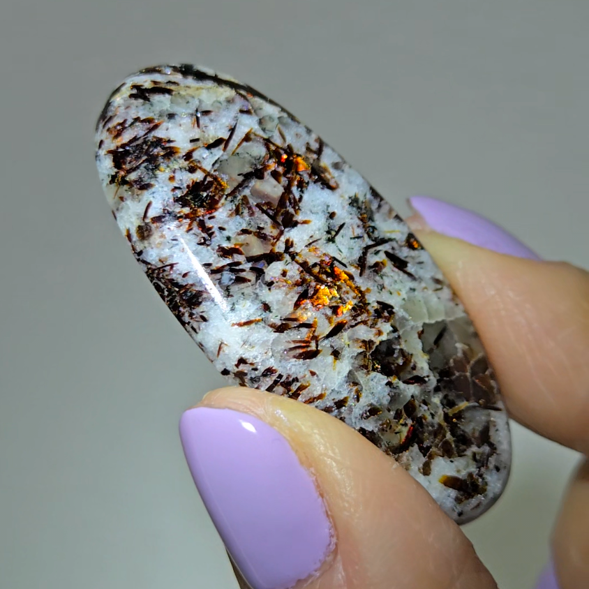 Astrophyllite cabochon with copper-colored inclusions - AST8