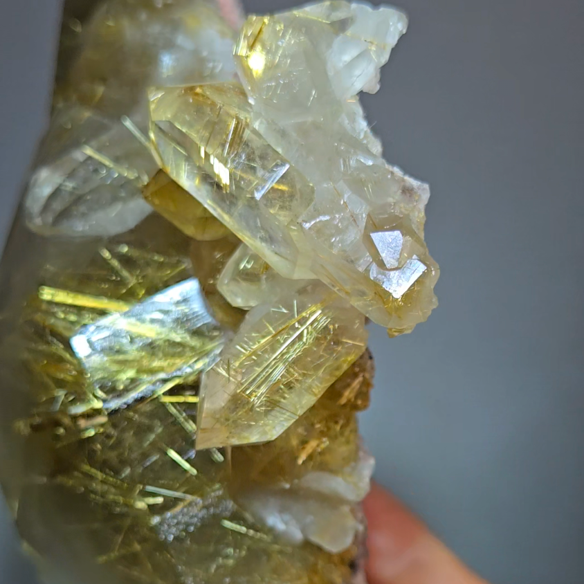 Golden titanium rutiles on black hematite in quartz cluster - RT1443