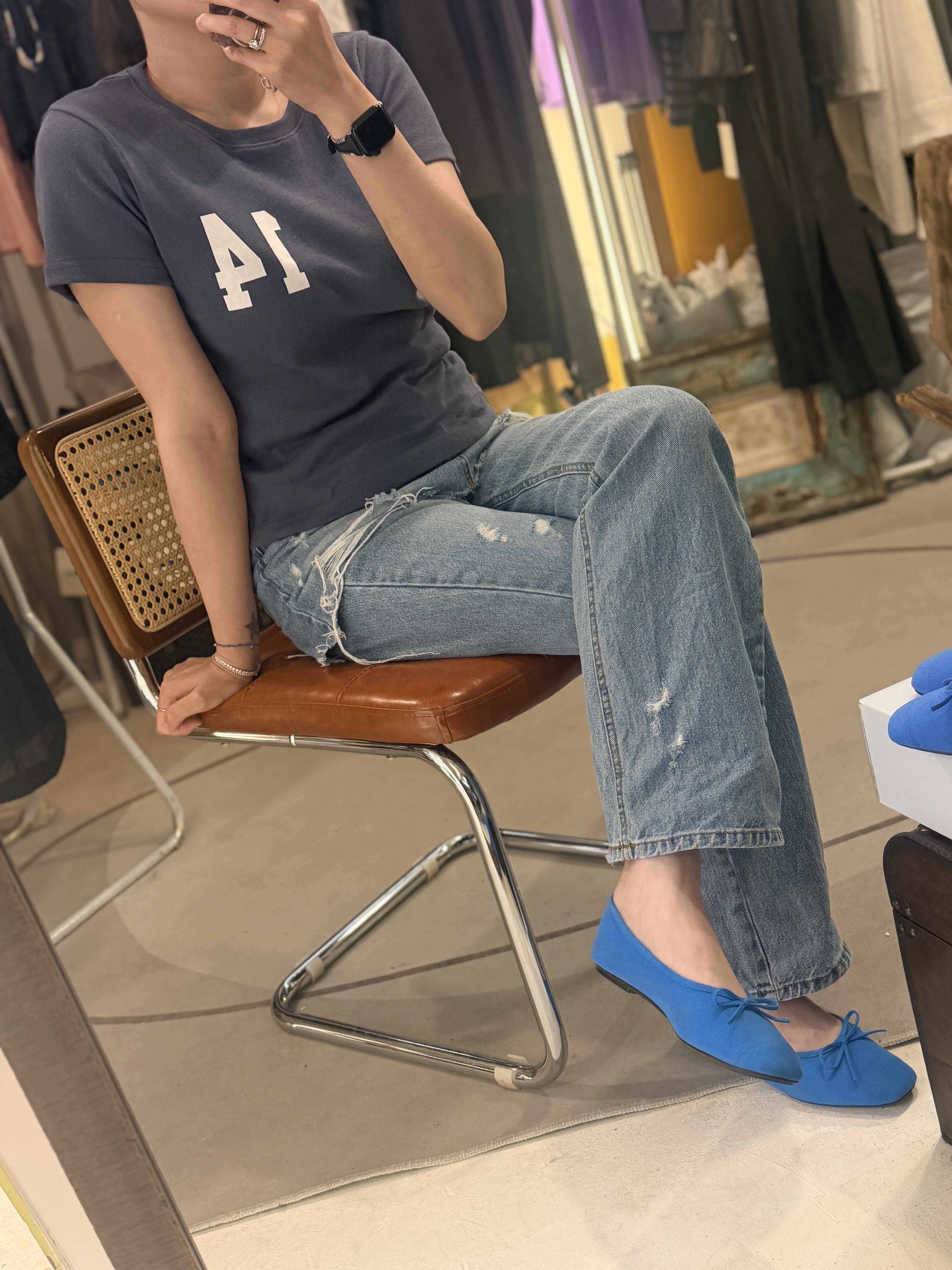 Denim skirt over jeans