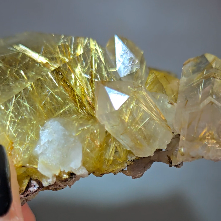 Golden titanium rutiles on black hematite in quartz cluster - RT1443
