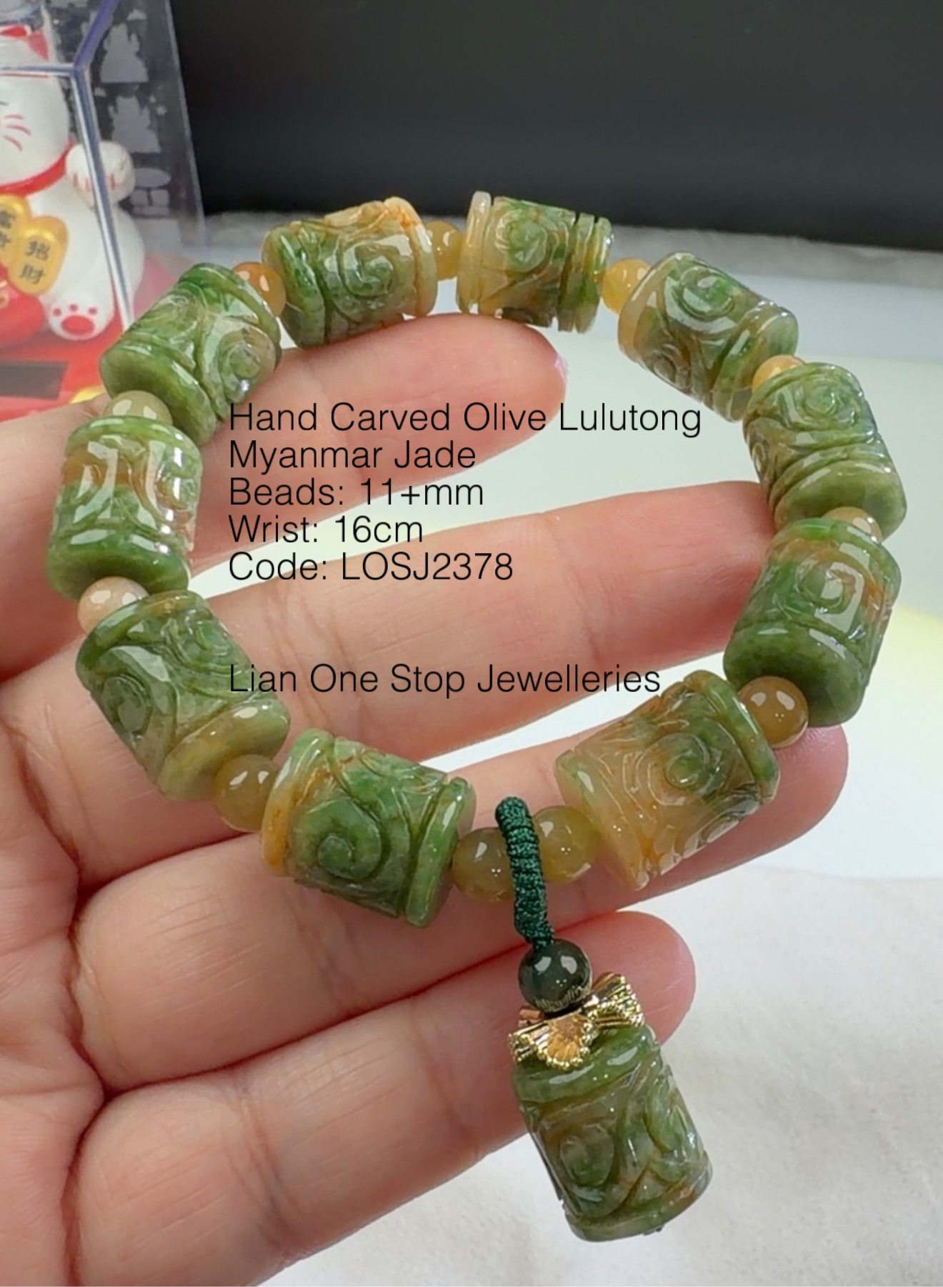 Code: LOSJ2378 Hand Carved Olive Lulutong Myanmar Jade 11+mm 