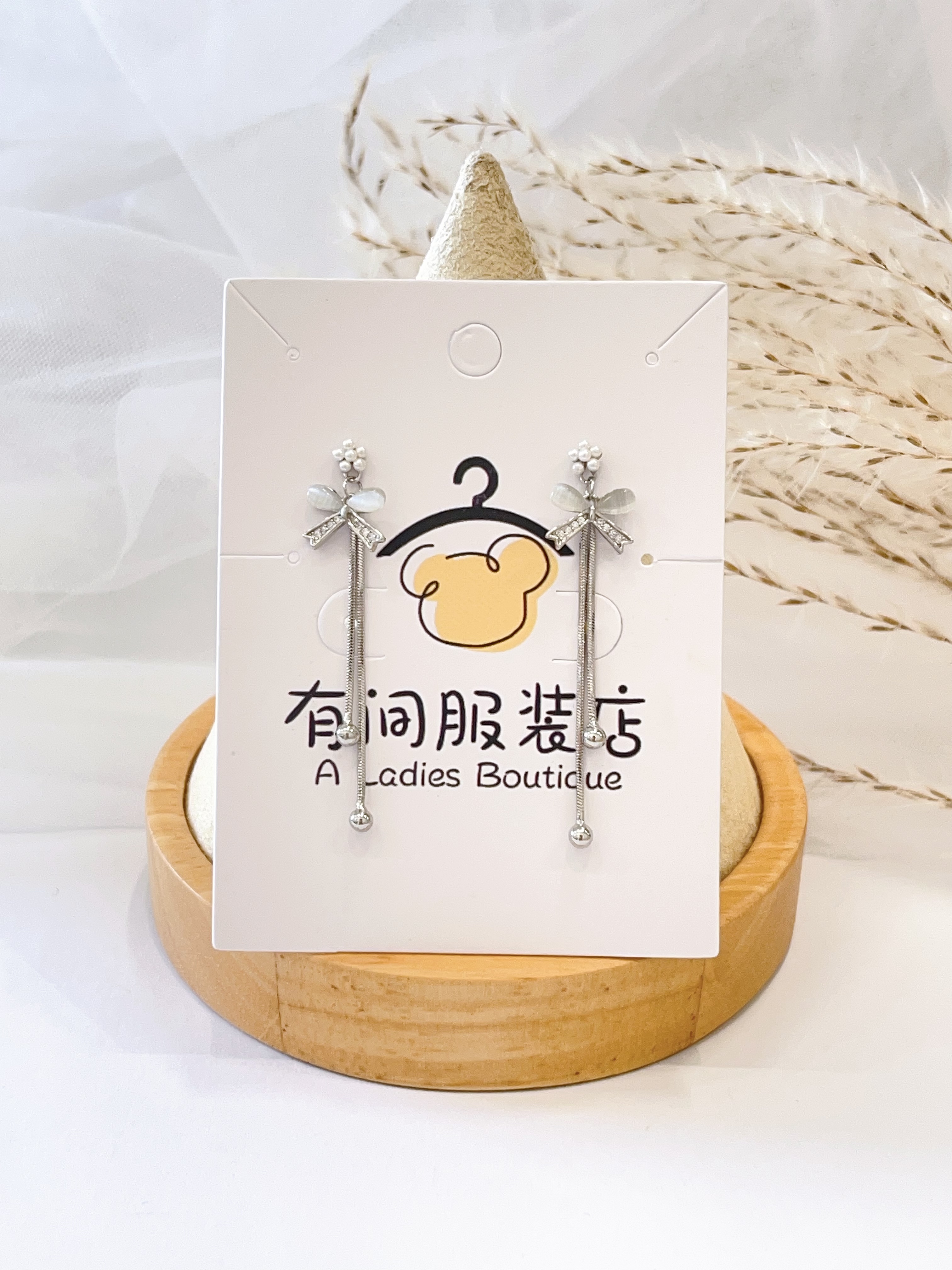 猫眼石蝴蝶结长流苏耳环