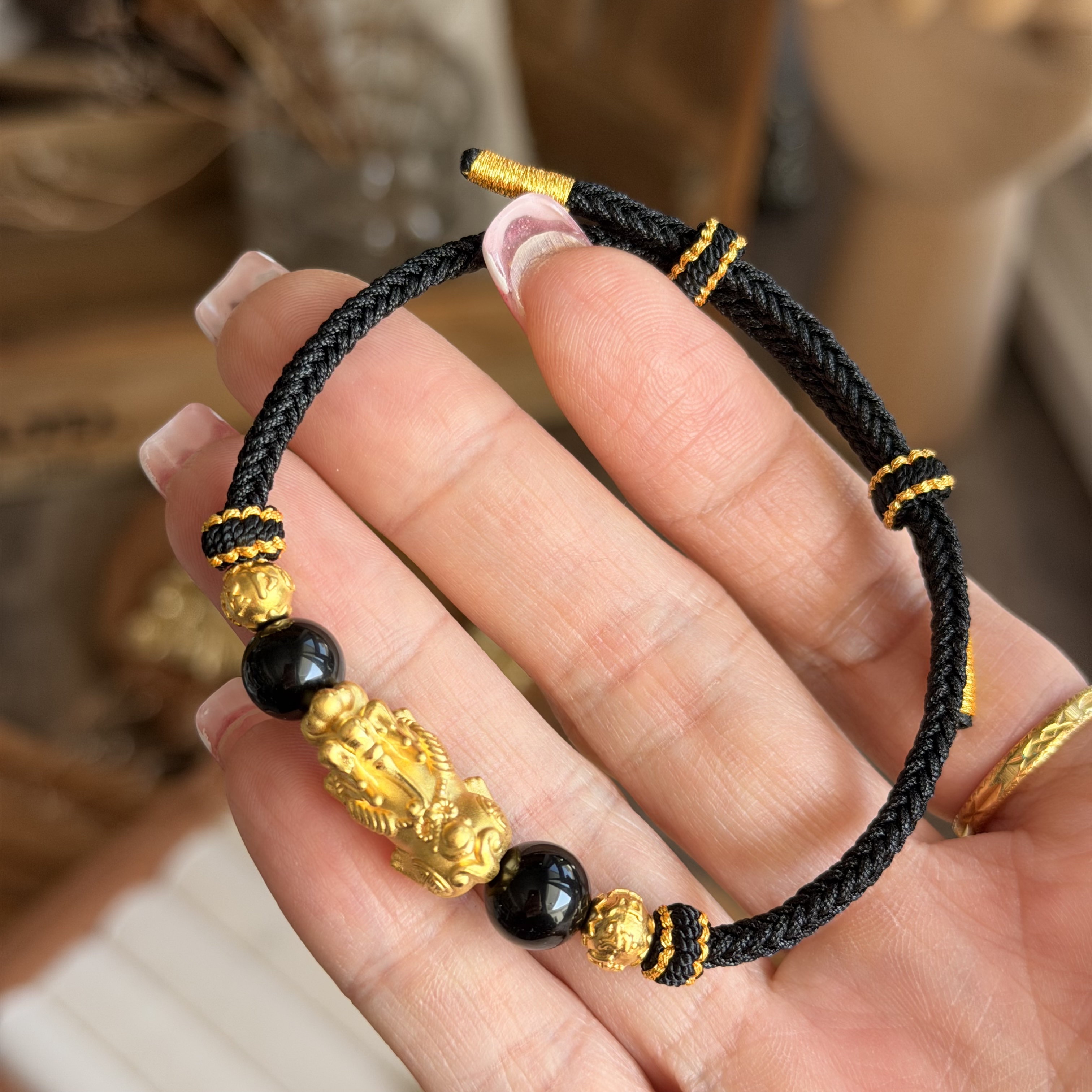999硬金貔貅+6mm硬金金珠襯黑曜石手繩