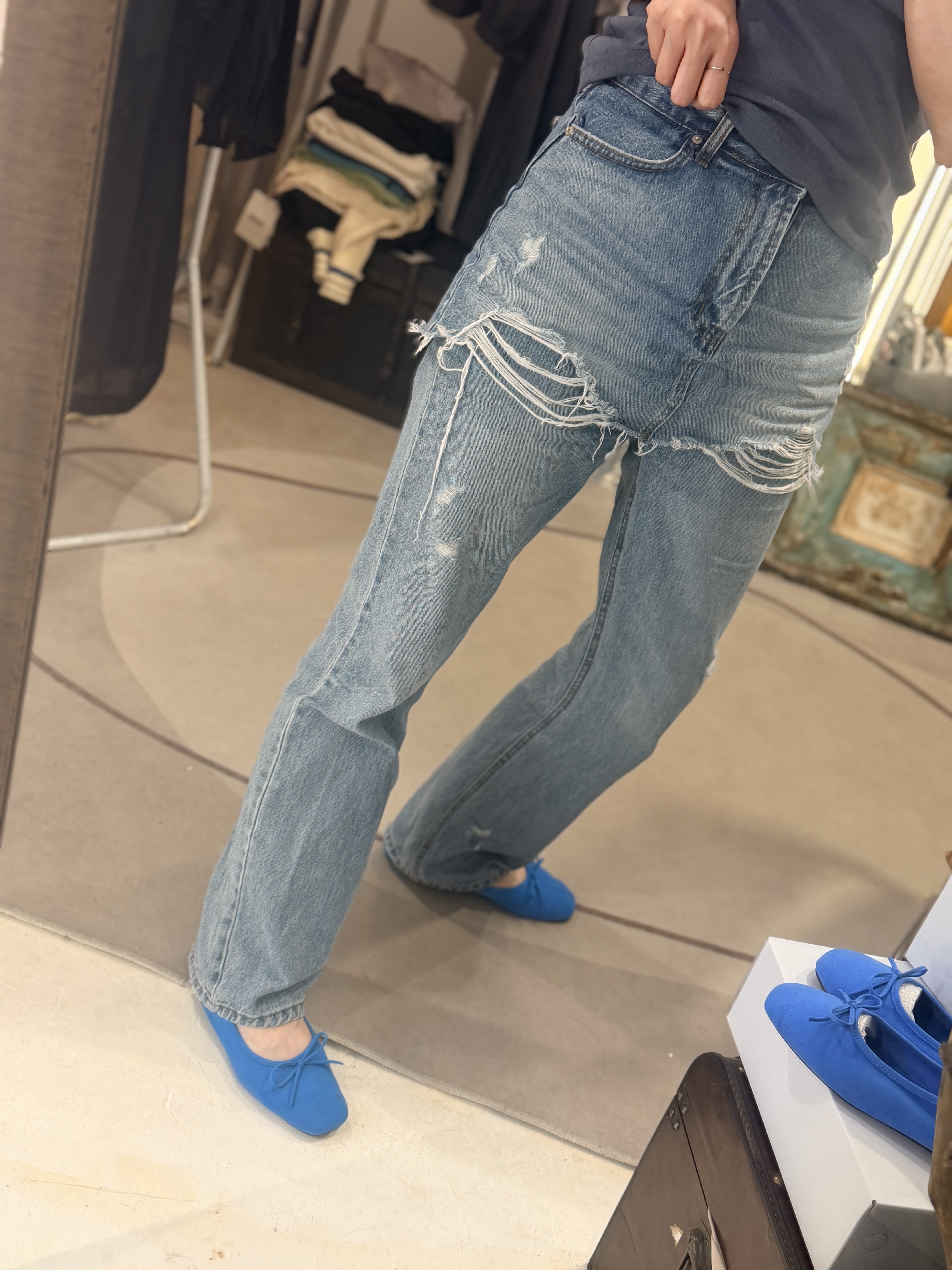 Denim skirt over jeans