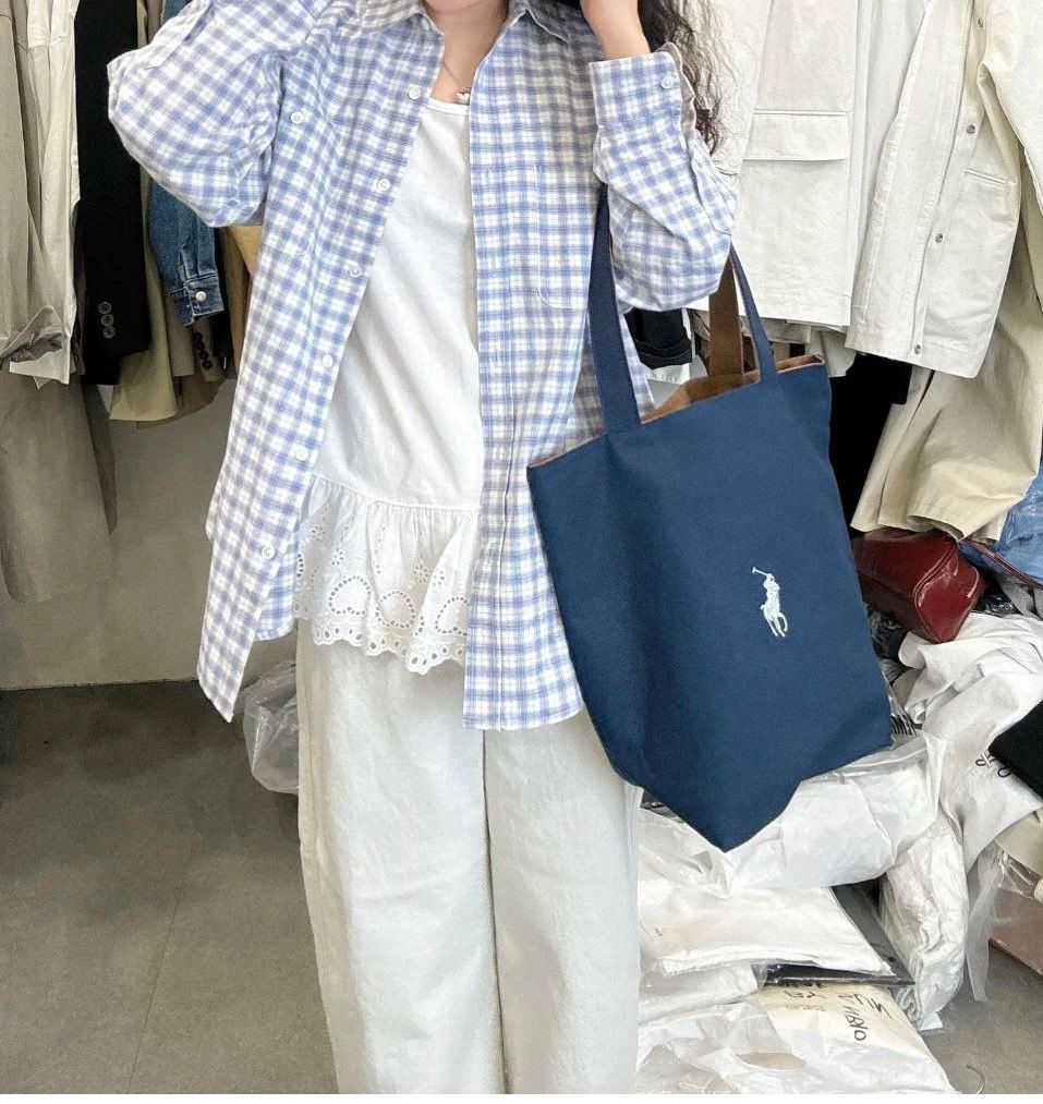 $115隻。2隻起$105隻。RL Polo雙面帆布托特包